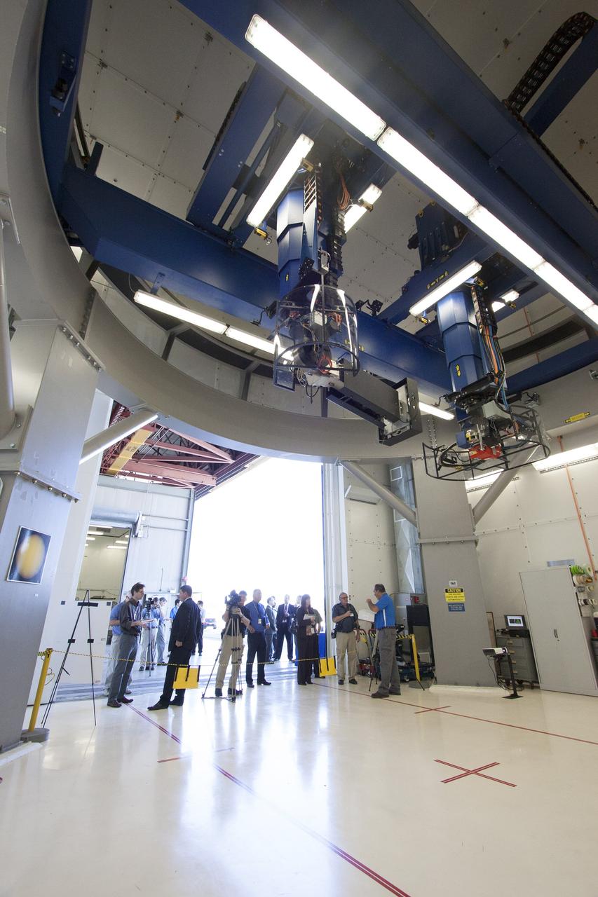CAPE CANAVERAL, Fla. – Paul Vona, operations engineer, NDT Services, with PaR Systems Inc., demonstrates the automated X-ray system in the robotic inspection cell for members of the media at Hangar N at Cape Canaveral Air Force Station in Florida. PaR Systems held an Open House to celebrate the one-year anniversary of a lease agreement with Kennedy. Under a 15-year lease, PaR Systems is utilizing Hangar N and its unique nondestructive testing equipment.     The partnership agreement was established by Kennedy's Center Planning and Development Directorate. The agreement is just one example of the types of partnerships that Kennedy is seeking to create a multi-user spaceport.  Photo credit: NASA/Cory Huston
