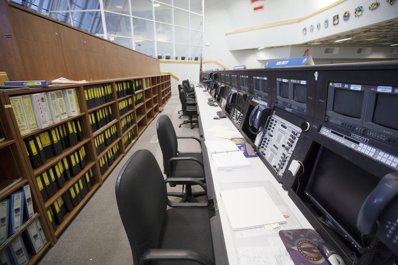 CAPE CANAVERAL, Fla. – Three rows of upper level management consoles are all that remain in Firing Room 4 in the Launch Control Center at NASA’s Kennedy Space Center in Florida. The main floor consoles, cabling and wires below the floor and ceiling tiles above have been removed. The Ground Systems Development and Operations Program is overseeing efforts to create a new firing room based on a multi-user concept that will support NASA and commercial launch needs. The design of Firing Room 4 will incorporate five control room areas that are flexible to meet current and future NASA and commercial user requirements. The equipment and most of the consoles from Firing Room 4 were moved to Firing Room 2 for possible future reuse. Photo credit: NASA/Ben Smegelsky