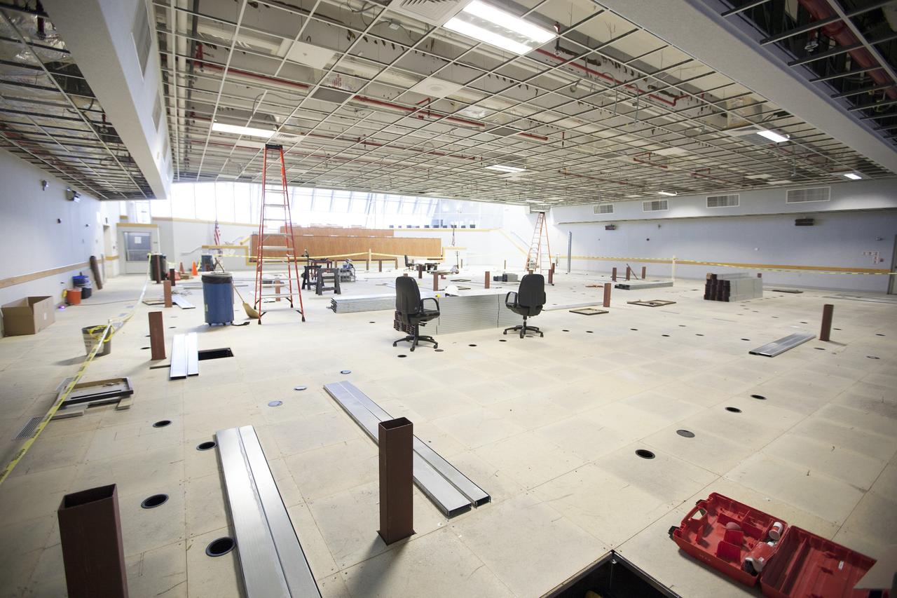 CAPE CANAVERAL, Fla. – The Ground Systems Development and Operations Program is overseeing efforts to create a new multi-user firing room in Firing Room 4 in the Launch Control Center at NASA's Kennedy Space Center in Florida. The main floor consoles, cabling and wires below the floor and ceiling tiles have been removed. Sub-flooring has been installed and the room is marked off to create four separate rooms on the main floor.     The design of Firing Room 4 will incorporate five control room areas that are flexible to meet current and future NASA and commercial user requirements. The equipment and most of the consoles from Firing Room 4 were moved to Firing Room 2 for possible future reuse. Photo credit: NASA/Ben Smegelsky
