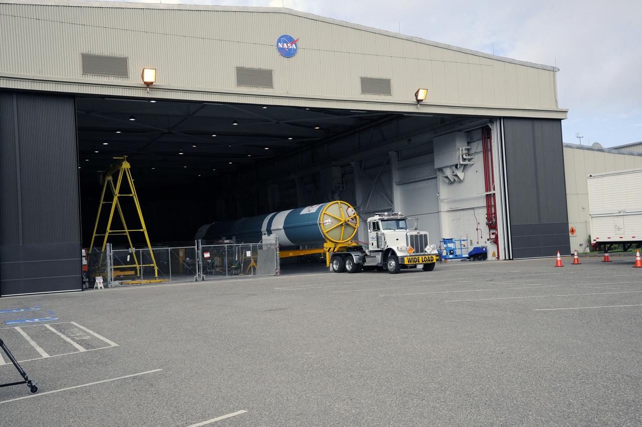 VANDENBERG AIR FORCE BASE, Calif. – Preparations are underway to tow the Delta first-stage booster for NASA's Orbiting Carbon Observatory-2 mission, or OCO-2, from the Building 836 hangar to the Horizontal Processing Facility at Space Launch Complex 2 on Vandenberg Air Force Base in California.       OCO-2 is scheduled to launch aboard a United Launch Alliance Delta II rocket on July 1, 2014.  The observatory will collect precise global measurements of carbon dioxide in the Earth's atmosphere and provide scientists with a better idea of the chemical compound's impacts on climate change. Scientists will analyze this data to improve our understanding of the natural processes and human activities that regulate the abundance and distribution of this important atmospheric gas. To learn more about OCO-2, visit http://oco.jpl.nasa.gov.  Photo credit: NASA/D. Liberotti, 30th Space Wing, VAFB