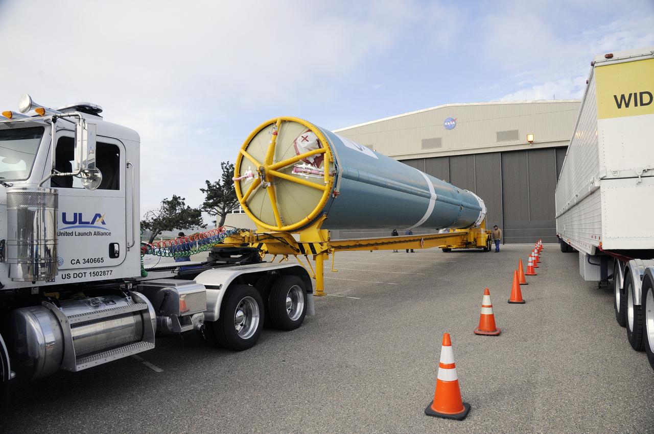 VANDENBERG AIR FORCE BASE, Calif. – The Delta first-stage booster for NASA's Orbiting Carbon Observatory-2 mission, or OCO-2, rolls out of the Building 836 hangar for its trip along the roads on Vandenberg Air Force Base in California to the Horizontal Processing Facility at Space Launch Complex 2.       OCO-2 is scheduled to launch aboard a United Launch Alliance Delta II rocket on July 1, 2014.  The observatory will collect precise global measurements of carbon dioxide in the Earth's atmosphere and provide scientists with a better idea of the chemical compound's impacts on climate change. Scientists will analyze this data to improve our understanding of the natural processes and human activities that regulate the abundance and distribution of this important atmospheric gas. To learn more about OCO-2, visit http://oco.jpl.nasa.gov.  Photo credit: NASA/D. Liberotti, 30th Space Wing, VAFB