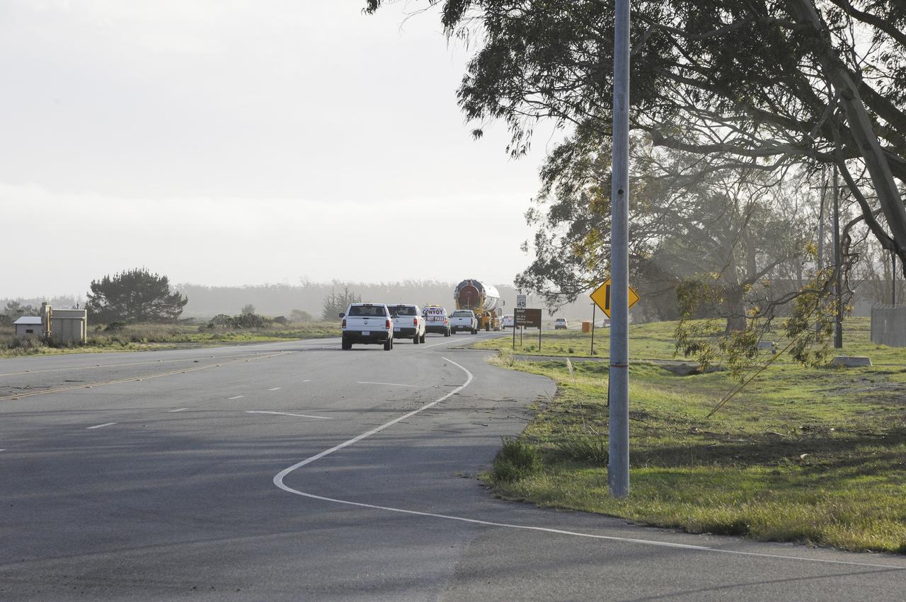 VANDENBERG AIR FORCE BASE, Calif. – The Delta first-stage booster for NASA's Orbiting Carbon Observatory-2 mission, or OCO-2, is escorted along the roads at Vandenberg Air Force Base in California on its move from the Building 836 hangar to the Horizontal Processing Facility at Space Launch Complex 2.    OCO-2 is scheduled to launch aboard a United Launch Alliance Delta II rocket on July 1, 2014.  The observatory will collect precise global measurements of carbon dioxide in the Earth's atmosphere and provide scientists with a better idea of the chemical compound's impacts on climate change. Scientists will analyze this data to improve our understanding of the natural processes and human activities that regulate the abundance and distribution of this important atmospheric gas. To learn more about OCO-2, visit http://oco.jpl.nasa.gov.  Photo credit: NASA/D. Liberotti, 30th Space Wing, VAFB