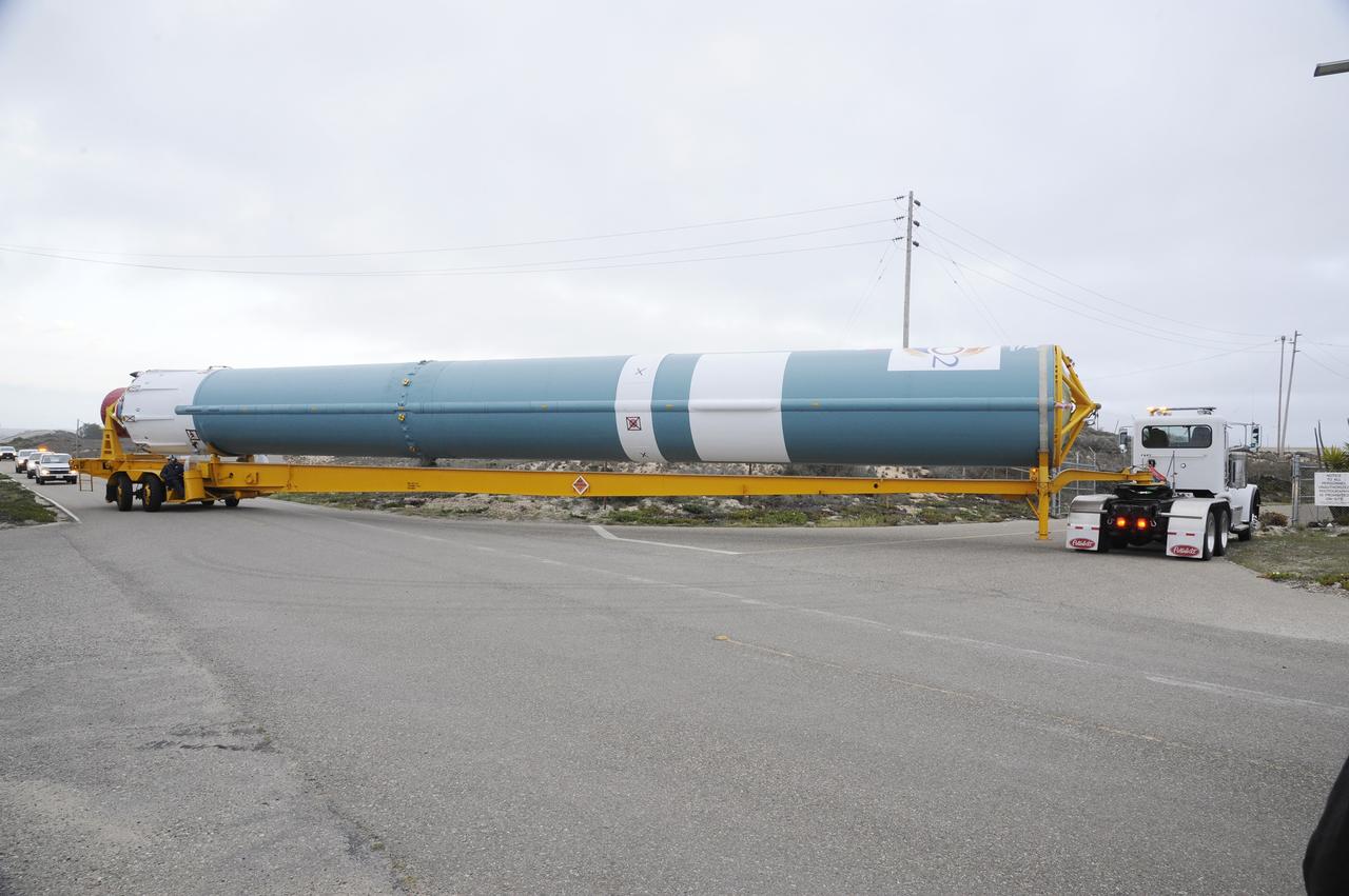 VANDENBERG AIR FORCE BASE, Calif. – The Delta first-stage booster for NASA's Orbiting Carbon Observatory-2 mission, or OCO-2, makes a steep turn toward the Horizontal Processing Facility at Space Launch Complex 2 on Vandenberg Air Force Base in California.    OCO-2 is scheduled to launch aboard a United Launch Alliance Delta II rocket on July 1, 2014.  The observatory will collect precise global measurements of carbon dioxide in the Earth's atmosphere and provide scientists with a better idea of the chemical compound's impacts on climate change. Scientists will analyze this data to improve our understanding of the natural processes and human activities that regulate the abundance and distribution of this important atmospheric gas. To learn more about OCO-2, visit http://oco.jpl.nasa.gov.  Photo credit: NASA/D. Liberotti, 30th Space Wing, VAFB