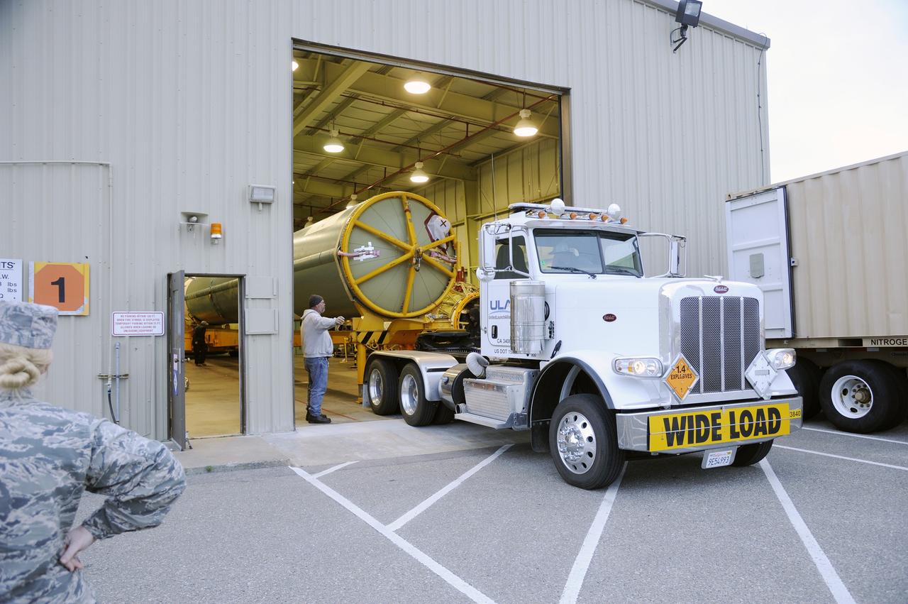 VANDENBERG AIR FORCE BASE, Calif. – The Delta first-stage booster for NASA's Orbiting Carbon Observatory-2 mission, or OCO-2, rolls into position through the open door of the Horizontal Processing Facility at Space Launch Complex 2 on Vandenberg Air Force Base in California.    OCO-2 is scheduled to launch aboard a United Launch Alliance Delta II rocket on July 1, 2014.  The observatory will collect precise global measurements of carbon dioxide in the Earth's atmosphere and provide scientists with a better idea of the chemical compound's impacts on climate change. Scientists will analyze this data to improve our understanding of the natural processes and human activities that regulate the abundance and distribution of this important atmospheric gas. To learn more about OCO-2, visit http://oco.jpl.nasa.gov.  Photo credit: NASA/D. Liberotti, 30th Space Wing, VAFB