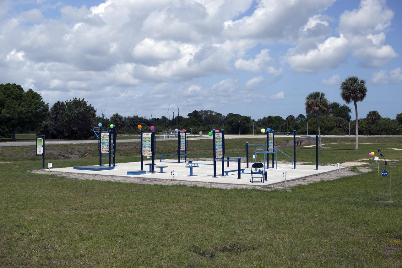 CAPE CANAVERAL, Fla. - Construction of an exercise pad is underway beside the new fitness trail next to the Space Station Processing Facility at NASA's Kennedy Space Center in Florida. The one-mile-long track will provide employees with a safe place off Kennedy's roadways to walk or run. The more than 6 tons of green waste removed to create the trail's footprint will be mulched and used for cover at Kennedy's landfill. Approximately 1,594 tons of crawler fines -- ground-up crawler rock removed from the crawlerway in the Launch Complex 39 area -- was used for the foundation of the trail. Fitness equipment has been ordered and will be installed on a concrete slab at the trail's west end. After the equipment has been installed, the slab will be coated to provide a rubberized exercise pad. At Kennedy Space Center, the health and safety of every employee is paramount. To learn more about Kennedy, visit http://www.nasa.gov/kennedy. Photo credit: NASA/Frankie Martin