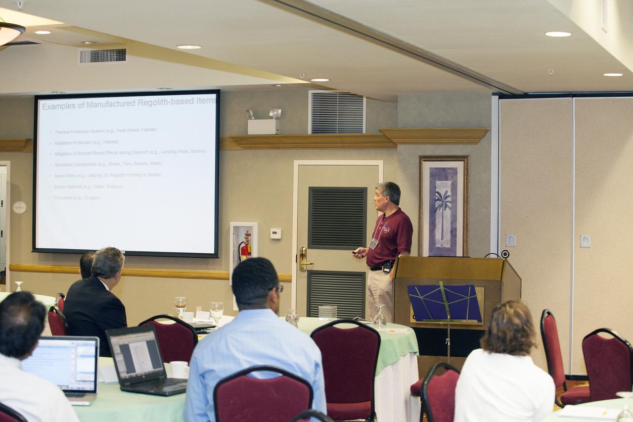 CAPE CANAVERAL, Fla. -- At the Marriott Courtyard Hotel in Cocoa Beach, Fla., James Mantovani of the NASA Surface Systems Office at NASA's Kennedy Space Center, speaks to participants in the 4th International Workshop on Lunar and Planetary Compact and Cryogenic Science and Technology Applications.      Scientists, engineers and entrepreneurs interested in research on the moon and other planetary surfaces, recently participated in the Workshop. Taking place April 8-11, 2014, the event was designed to foster collaborative work among those interested in solving the challenges of building hardware, software and businesses interested in going back to the moon and exploring beyond. Photo credit: NASA/Daniel Casper