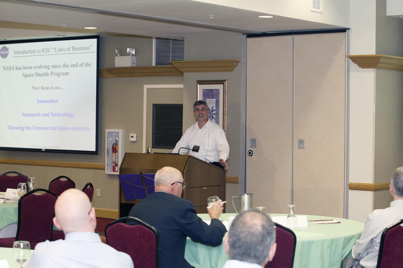CAPE CANAVERAL, Fla. -- At the Marriott Courtyard Hotel in Cocoa Beach, Fla., Greg Clements, chief of Kennedy's Control and Data Systems Division and lead for the Engineering and Technology's Small Payload Integrated Testing Services, or SPLITS, line of business, speaks to participants in the 4th International Workshop on Lunar and Planetary Compact and Cryogenic Science and Technology Applications.    Scientists, engineers and entrepreneurs interested in research on the moon and other planetary surfaces, recently participated in the Workshop. Taking place April 8-11, 2014, the event was designed to foster collaborative work among those interested in solving the challenges of building hardware, software and businesses interested in going back to the moon and exploring beyond. Photo credit: NASA/Daniel Casper