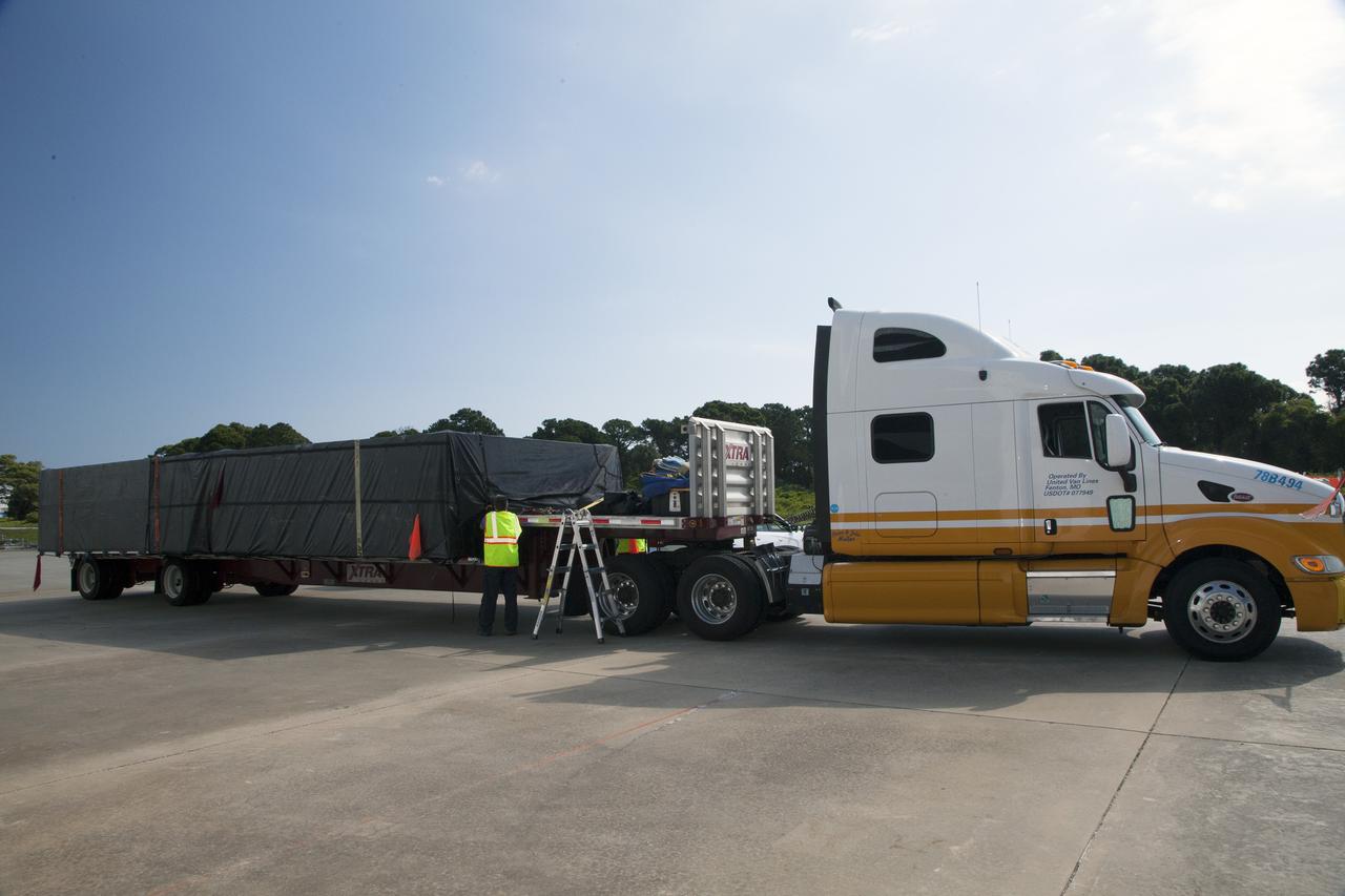 CAPE CANAVERAL, Fla. - The first set of Ogive panels for the Orion Launch Abort System arrives by truck at the Launch Abort System Facility at NASA’s Kennedy Space Center in Florida. During processing, the Ogive panels will enclose and protect the Orion spacecraft and attach to the Launch Abort System. Orion is the exploration spacecraft designed to carry astronauts to destinations not yet explored by humans, including an asteroid and Mars. It will have emergency abort capability, sustain the crew during space travel and provide safe re-entry from deep space return velocities. The first unpiloted test flight of Orion is scheduled to launch in 2014 atop a Delta IV rocket and in 2017 on NASA’s Space Launch System rocket. For more information, visit www.nasa.gov/orion. Photo credit: Daniel Casper