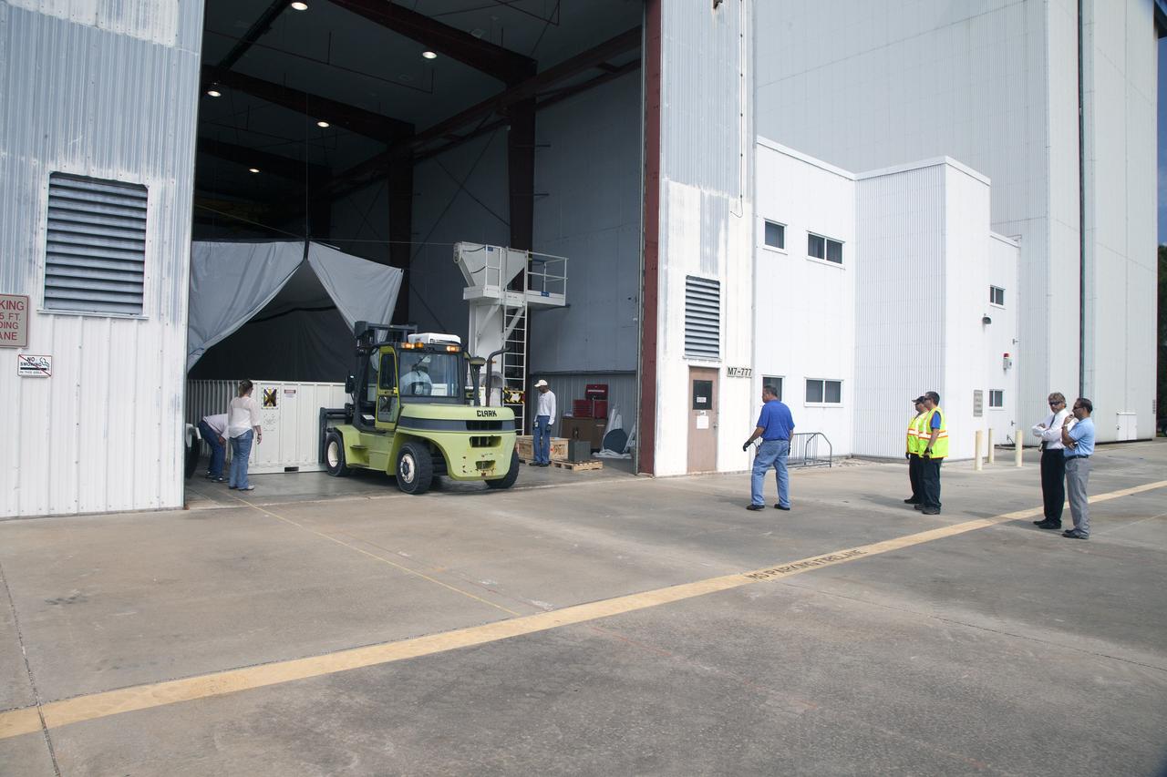 CAPE CANAVERAL, Fla. - Containers carrying the first set of Ogive panels for the Orion Launch Abort System have been transferred into the Launch Abort System Facility at NASA’s Kennedy Space Center in Florida. During processing, the Ogive panels will enclose and protect the Orion spacecraft and attach to the Launch Abort System. Orion is the exploration spacecraft designed to carry astronauts to destinations not yet explored by humans, including an asteroid and Mars. It will have emergency abort capability, sustain the crew during space travel and provide safe re-entry from deep space return velocities. The first unpiloted test flight of Orion is scheduled to launch in 2014 atop a Delta IV rocket and in 2017 on NASA’s Space Launch System rocket. For more information, visit www.nasa.gov/orion. Photo credit: Daniel Casper