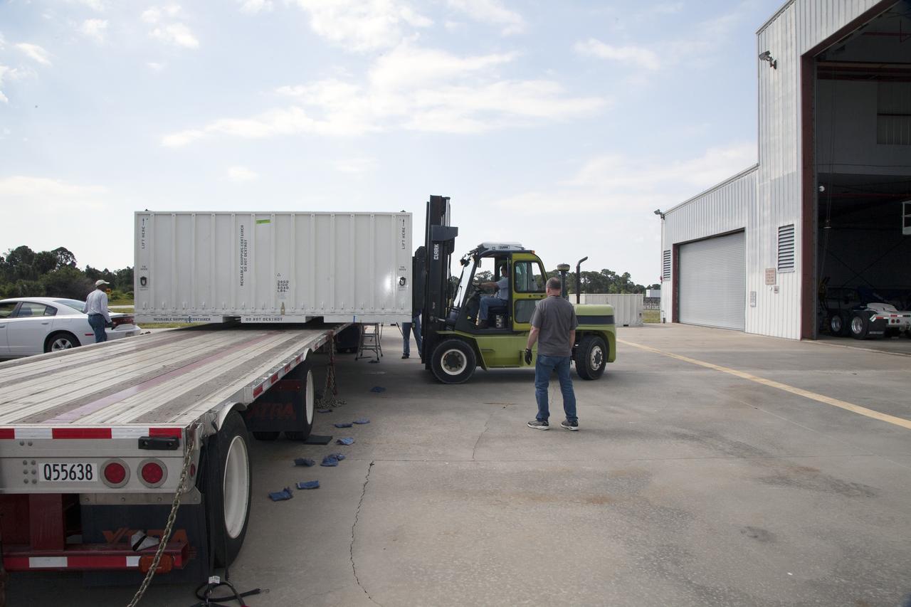 CAPE CANAVERAL, Fla. - A container carrying the first set of Ogive panels for the Orion Launch Abort System is offloaded for transfer into the Launch Abort System Facility at NASA’s Kennedy Space Center in Florida. During processing, the Ogive panels will enclose and protect the Orion spacecraft and attach to the Launch Abort System. Orion is the exploration spacecraft designed to carry astronauts to destinations not yet explored by humans, including an asteroid and Mars. It will have emergency abort capability, sustain the crew during space travel and provide safe re-entry from deep space return velocities. The first unpiloted test flight of Orion is scheduled to launch in 2014 atop a Delta IV rocket and in 2017 on NASA’s Space Launch System rocket. For more information, visit www.nasa.gov/orion. Photo credit: Daniel Casper