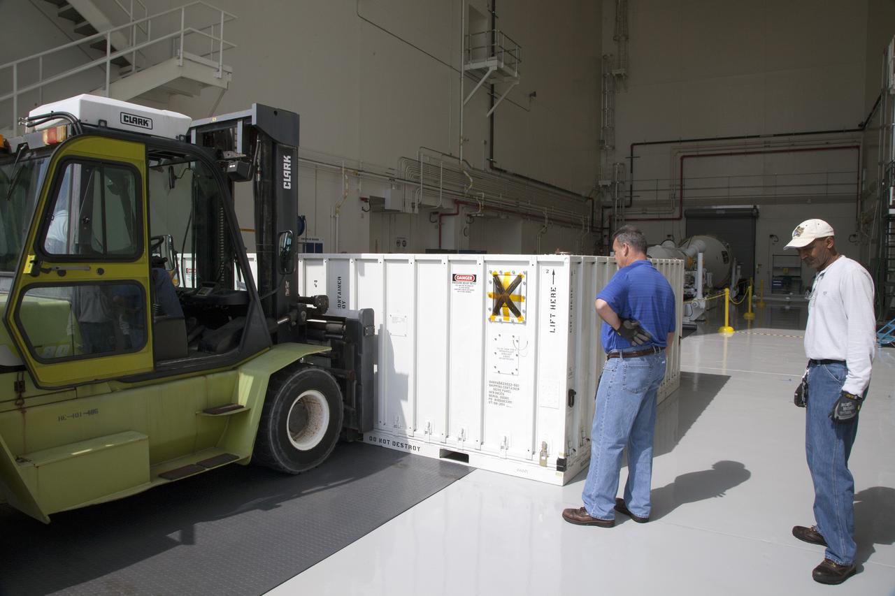CAPE CANAVERAL, Fla. - A container carrying the first set of Ogive panels for the Orion Launch Abort System is transferred into the Launch Abort System Facility at NASA’s Kennedy Space Center in Florida. During processing, the Ogive panels will enclose and protect the Orion spacecraft and attach to the Launch Abort System. Orion is the exploration spacecraft designed to carry astronauts to destinations not yet explored by humans, including an asteroid and Mars. It will have emergency abort capability, sustain the crew during space travel and provide safe re-entry from deep space return velocities. The first unpiloted test flight of Orion is scheduled to launch in 2014 atop a Delta IV rocket and in 2017 on NASA’s Space Launch System rocket. For more information, visit www.nasa.gov/orion. Photo credit: Daniel Casper
