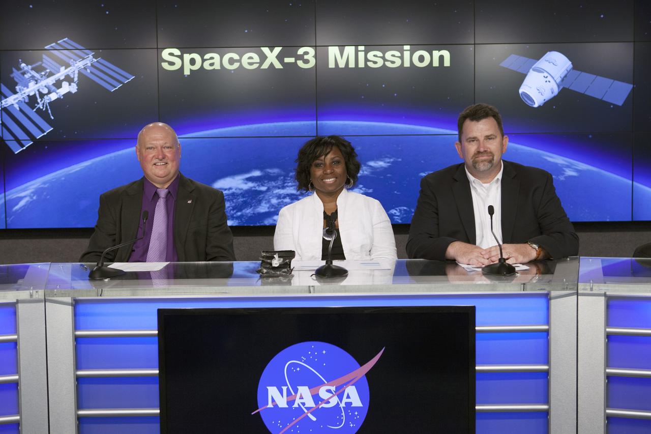 CAPE CANAVERAL, Fla. – During a news conference at NASA's Kennedy Space Center in Florida, agency and contractor officials discussed science and technology experiment payloads being transported to the International Space Station by the SpaceX-3 Commercial Resupply Services mission. Participating in the briefing, from the left, are Mike Curie of NASA Public Affairs, Camille Alleyne, assistant program scientist in the NASA ISS Program Science Office, and Michael Roberts, senior research pathway manager with the Center for the Advancement of Science in Space CASIS. Andy Petro of the agency's Space Technology Mission Directorate participated in the briefing by telephone from NASA Headquarters in Washington D.C.      Scheduled for launch on April 14, 2014 atop a Falcon 9 rocket, the Dragon spacecraft will be marking its fourth trip to the space station. The SpaceX-3 mission carrying almost 2.5 tons of supplies, technology and science experiments is the third of 12 flights contracted by NASA to resupply the orbiting laboratory. For more information, visit http://www.nasa.gov/mission_pages/station/structure/launch/index.html Photo credit: NASA/ Kim Shiflett