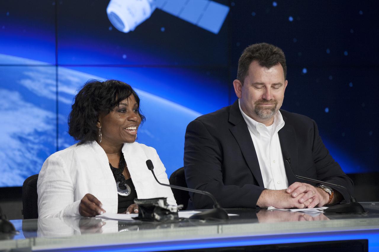 CAPE CANAVERAL, Fla. – During a news conference at NASA's Kennedy Space Center in Florida, agency and contractor officials discussed science and technology experiment payloads being transported to the International Space Station by the SpaceX-3 Commercial Resupply Services mission. Participating in the briefing, from the left, are Camille Alleyne, assistant program scientist in the NASA ISS Program Science Office, and Michael Roberts, senior research pathway manager with the Center for the Advancement of Science in Space CASIS.      Scheduled for launch on April 14, 2014 atop a Falcon 9 rocket, the Dragon spacecraft will be marking its fourth trip to the space station. The SpaceX-3 mission carrying almost 2.5 tons of supplies, technology and science experiments is the third of 12 flights contracted by NASA to resupply the orbiting laboratory. For more information, visit http://www.nasa.gov/mission_pages/station/structure/launch/index.html Photo credit: NASA/ Kim Shiflett