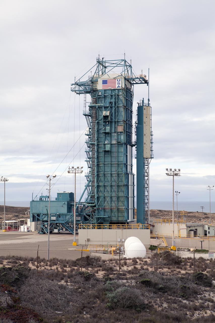 VANDENBERG AIR FORCE BASE, Calif. – An American flag adorns the top of the Delta II launcher at Space Launch Complex 2 on Vandenberg Air Force Base in California where preparations are underway for the upcoming launch of NASA's Orbiting Carbon Observatory-2 mission, or OCO-2, in July.    The observatory will collect precise global measurements of carbon dioxide in the Earth's atmosphere and provide scientists with a better idea of the chemical compound's impacts on climate change. Scientists will analyze this data to improve our understanding of the natural processes and human activities that regulate the abundance and distribution of this important atmospheric gas. To learn more about OCO-2, visit http://oco.jpl.nasa.gov.  Photo credit: NASA/Kim Shiflett