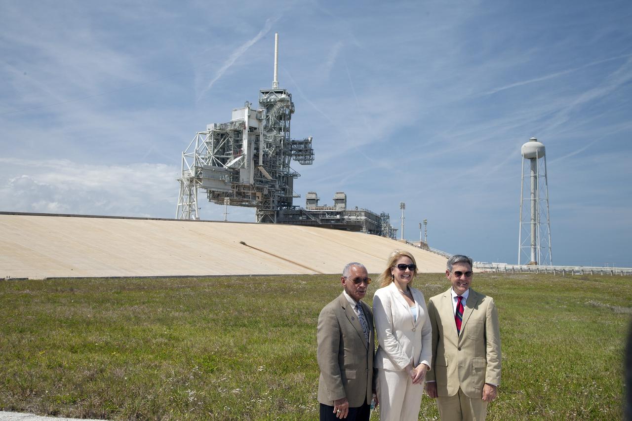CAPE CANAVERAL, Fla. -- At Kennedy Space Center's Launch Pad 39A, from the left, NASA Administrator Charlie Bolden, Gwynne Shotwell, president and chief operating officer of Space Exploration Technologies SpaceX and Kennedy Space Center Director Bob Cabana pose in from the of the historic launch complex after announcing that NASA has just signed a lease agreement with SpaceX for use and operation of Launch Complex 39A.        SpaceX will use Launch Complex 39A for rockets such as the Falcon Heavy, currently under development. Both launch pad 39A and 39B were originally built for the Apollo/Saturn V rockets that launched American astronauts on their historic journeys to the moon and later modified to support the 30-year shuttle program. Pad 39B is now being modified by NASA to support the Space Launch System SLS rocket boosting the Orion spacecraft part of the agency’s plan to explore beyond low-Earth orbit. To learn more about Launch Pad 39A visit: http://www.nasa.gov/mission_pages/shuttle/launch/launch-complex39-toc.html Photo credit: NASA/Dan Casper