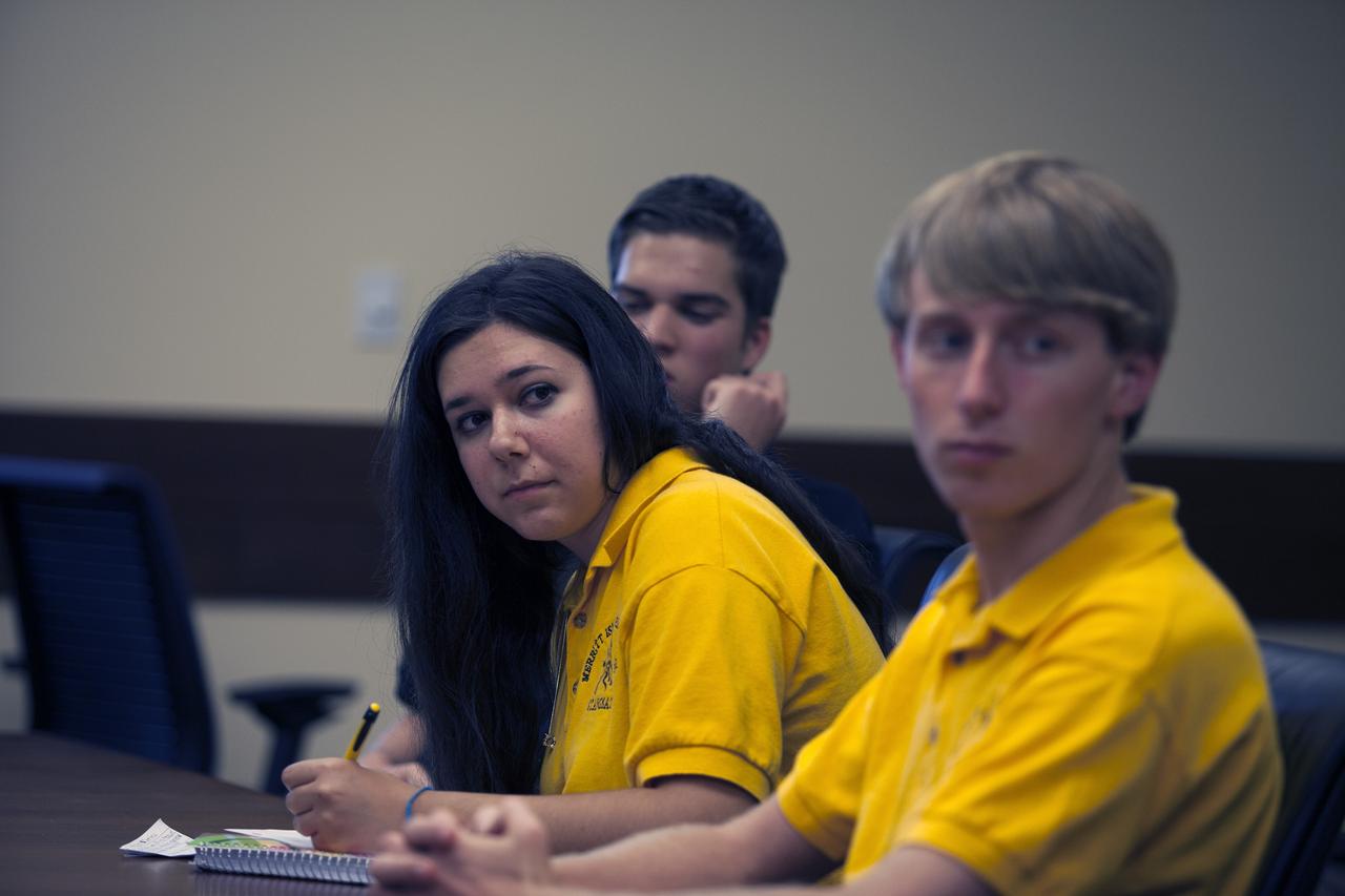 CAPE CANAVERAL, Fla. – Merritt Island High School students participate in a Critical Design Review of StangSat concepts with NASA engineers in the Operations and Checkout Building at NASA's Kennedy Space Center in Florida.     StangSat is one of many CubeSats under development in a class of research spacecraft called nanosatellites. The cube-shaped satellites measure about 4 inches on each side, have a volume of about 1 quart and weigh less than 3 pounds. To date, 27 CubeSats have launched through the initiative as part of the agency's Launch Services Program's Educational Launch of Nanosatellite Program. This year, four separate launches will carry 17 CubeSats. To learn more about the CubeSat Launch Initiative, visit http://go.nasa.gov/CubeSat_initiative.  Photo credit: NASA/Ben Smegelsky