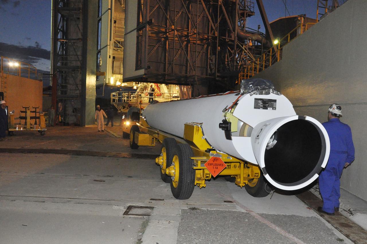 VANDENBERG AIR FORCE BASE, Calif. – A solid rocket motor, or SRM, for NASA's Orbiting Carbon Observatory-2 mission, or OCO-2, arrives at the mobile service tower at Space Launch Complex 2 on Vandenberg Air Force Base in California. Operations are underway to attach the Delta II rocket's three SRMs, known as graphite epoxy motors, to the rocket's first stage.    OCO-2 is scheduled to launch into a polar Earth orbit aboard a United Launch Alliance Delta II 7320-10C rocket in July. Once in orbit, OCO-2 will collect precise global measurements of carbon dioxide in the Earth's atmosphere and provide scientists with a better idea of the chemical compound's impacts on climate change. Scientists will analyze this data to improve our understanding of the natural processes and human activities that regulate the abundance and distribution of this important atmospheric gas. To learn more about OCO-2, visit http://oco.jpl.nasa.gov.  Photo credit: NASA/Randy Beaudoin