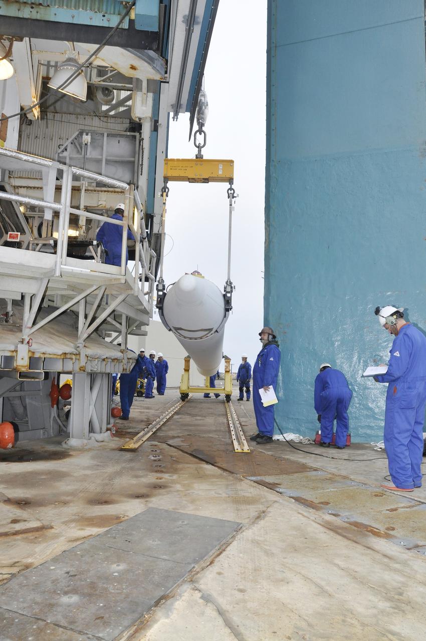 VANDENBERG AIR FORCE BASE, Calif. – A crane supports the solid rocket motor, or SRM, for NASA's Orbiting Carbon Observatory-2 mission, or OCO-2, following its delivery to the mobile service tower at Space Launch Complex 2 on Vandenberg Air Force Base in California. Operations are underway to attach the Delta II rocket's three SRMs, known as graphite epoxy motors, to the rocket's first stage. OCO-2 is scheduled to launch into a polar Earth orbit aboard a United Launch Alliance Delta II 7320-10C rocket in July. Once in orbit, OCO-2 will collect precise global measurements of carbon dioxide in the Earth's atmosphere and provide scientists with a better idea of the chemical compound's impacts on climate change. Scientists will analyze this data to improve our understanding of the natural processes and human activities that regulate the abundance and distribution of this important atmospheric gas. To learn more about OCO-2, visit http://oco.jpl.nasa.gov. Photo credit: NASA/Randy Beaudoin