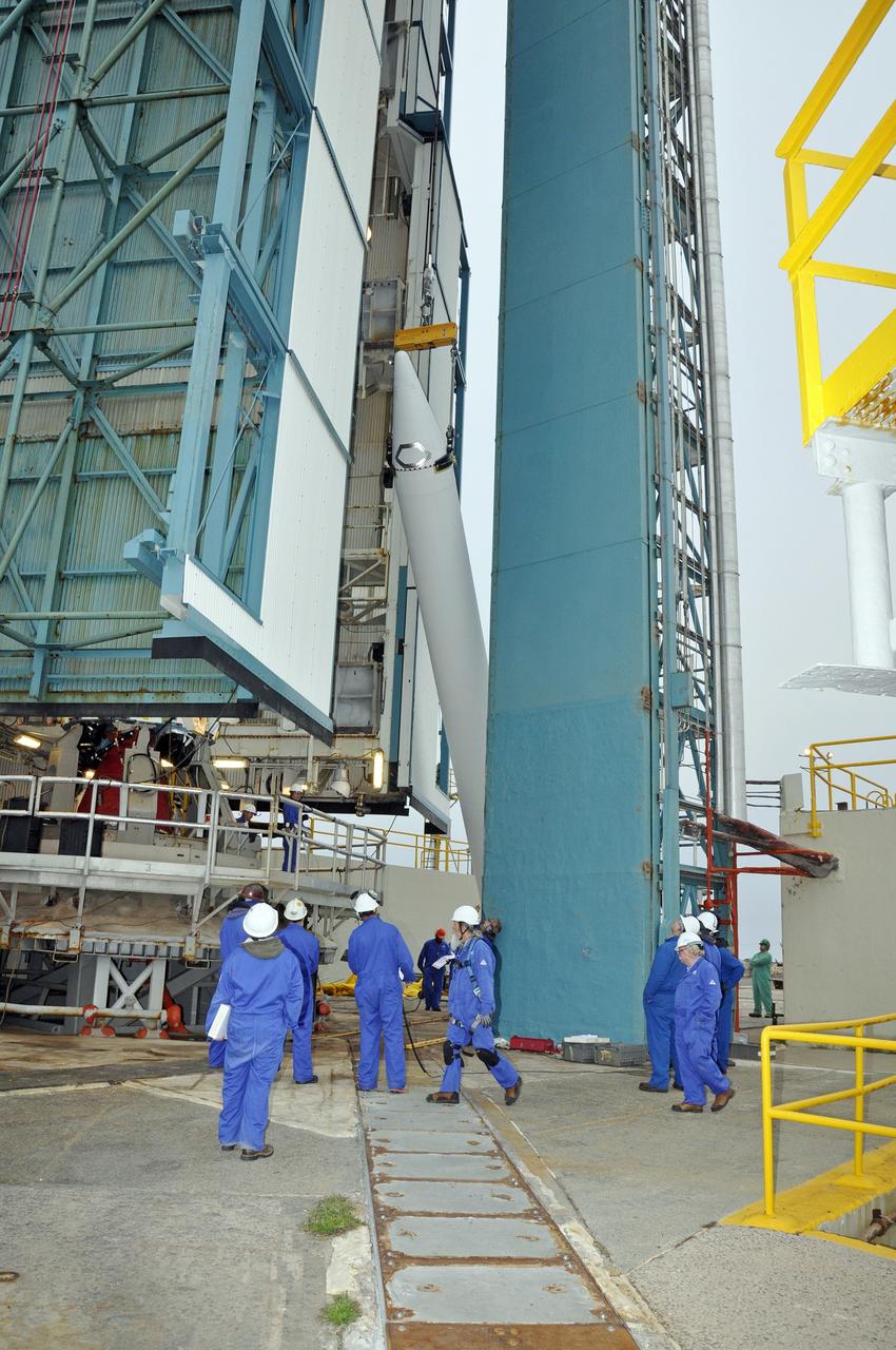 VANDENBERG AIR FORCE BASE, Calif. – A crane lifts the solid rocket motor, or SRM, for NASA's Orbiting Carbon Observatory-2 mission, or OCO-2, into a vertical position beside the mobile service tower at Space Launch Complex 2 on Vandenberg Air Force Base in California. Operations are underway to attach the Delta II rocket's three SRMs, known as graphite epoxy motors, to the rocket's first stage. OCO-2 is scheduled to launch into a polar Earth orbit aboard a United Launch Alliance Delta II 7320-10C rocket in July. Once in orbit, OCO-2 will collect precise global measurements of carbon dioxide in the Earth's atmosphere and provide scientists with a better idea of the chemical compound's impacts on climate change. Scientists will analyze this data to improve our understanding of the natural processes and human activities that regulate the abundance and distribution of this important atmospheric gas. To learn more about OCO-2, visit http://oco.jpl.nasa.gov. Photo credit: NASA/Randy Beaudoin