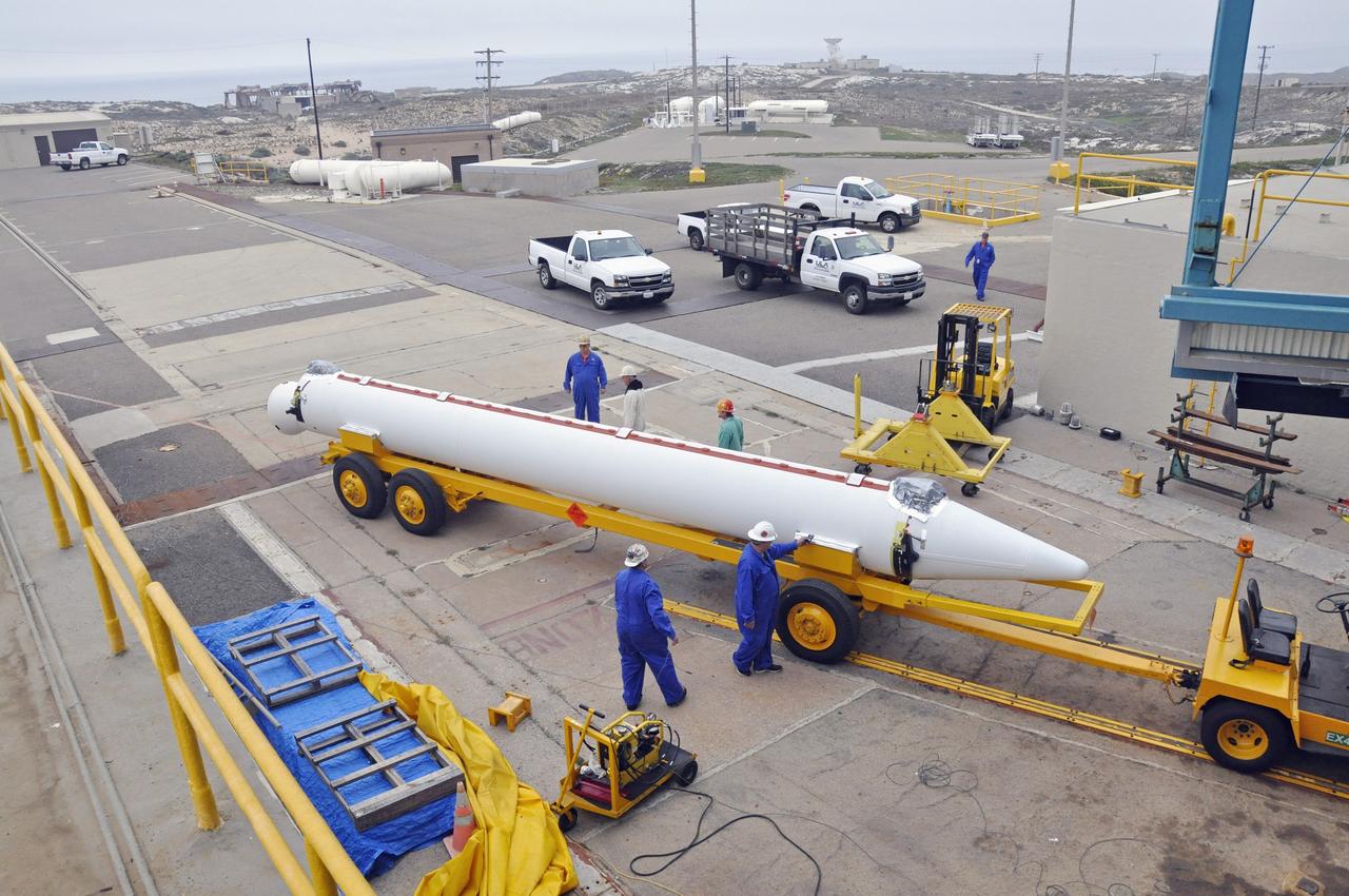 VANDENBERG AIR FORCE BASE, Calif. – A second solid rocket motor, or SRM, for NASA's Orbiting Carbon Observatory-2 mission, or OCO-2, is towed to Space Launch Complex 2 on Vandenberg Air Force Base in California. Operations are underway to attach the Delta II rocket's three SRMs, known as graphite epoxy motors, to the rocket's first stage.      OCO-2 is scheduled to launch into a polar Earth orbit aboard a United Launch Alliance Delta II 7320-10C rocket in July. Once in orbit, OCO-2 will collect precise global measurements of carbon dioxide in the Earth's atmosphere and provide scientists with a better idea of the chemical compound's impacts on climate change. Scientists will analyze this data to improve our understanding of the natural processes and human activities that regulate the abundance and distribution of this important atmospheric gas. To learn more about OCO-2, visit http://oco.jpl.nasa.gov.  Photo credit: NASA/Randy Beaudoin