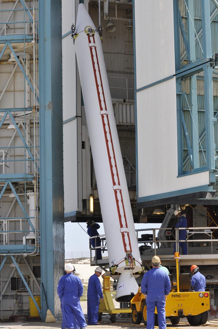 VANDENBERG AIR FORCE BASE, Calif. – Workers monitor the second solid rocket motor, or SRM, for NASA's Orbiting Carbon Observatory-2 mission, or OCO-2, as it is lifted into a vertical position beside the mobile service tower at Space Launch Complex 2 on Vandenberg Air Force Base in California. Operations are underway to attach the Delta II rocket's three SRMs, known as graphite epoxy motors, to its first stage. OCO-2 is scheduled to launch into a polar Earth orbit aboard a United Launch Alliance Delta II 7320-10C rocket in July. Once in orbit, OCO-2 will collect precise global measurements of carbon dioxide in the Earth's atmosphere and provide scientists with a better idea of the chemical compound's impacts on climate change. Scientists will analyze this data to improve our understanding of the natural processes and human activities that regulate the abundance and distribution of this important atmospheric gas. To learn more about OCO-2, visit http://oco.jpl.nasa.gov. Photo credit: NASA/Randy Beaudoin