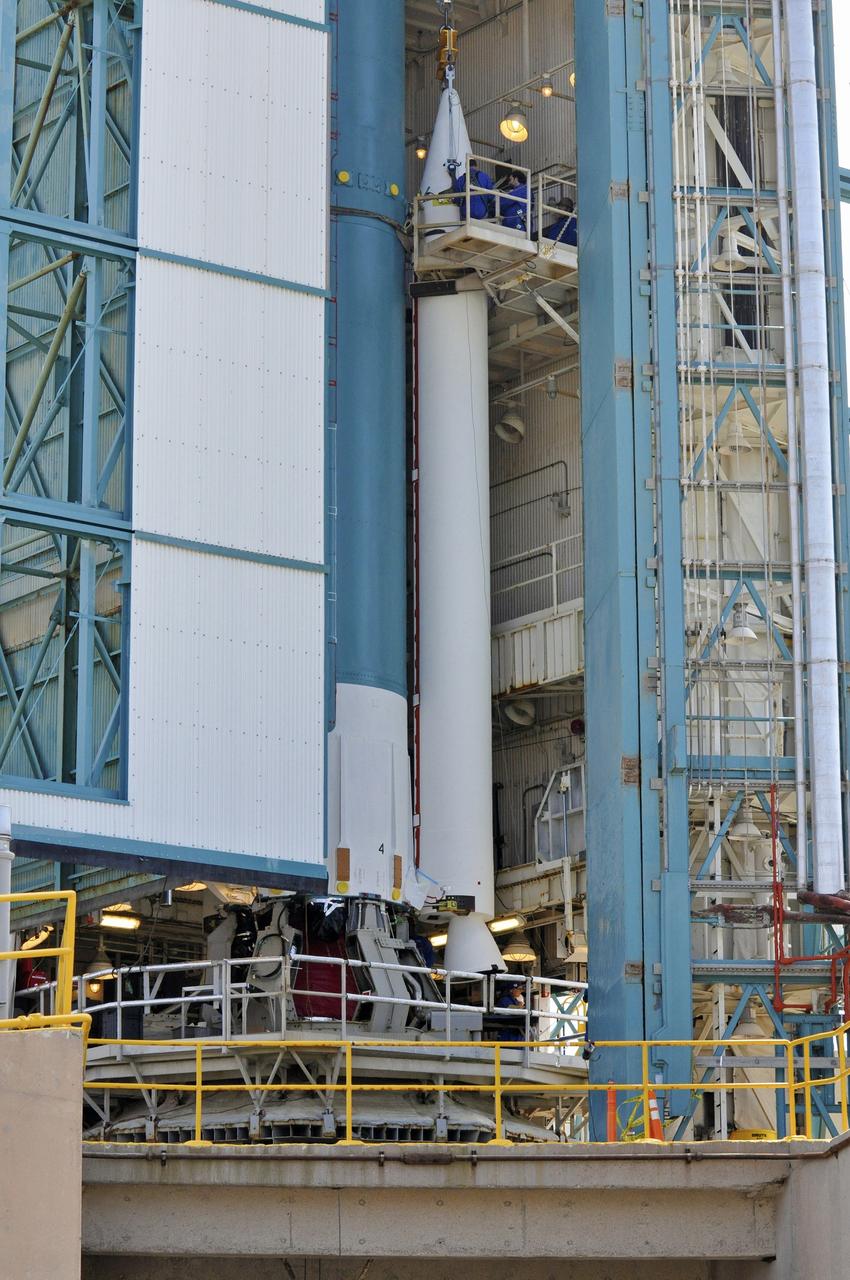VANDENBERG AIR FORCE BASE, Calif. – The second solid rocket motor, or SRM, for NASA's Orbiting Carbon Observatory-2 mission, or OCO-2, is lifted into the mobile service tower next to the Delta II first stage at Space Launch Complex 2 on Vandenberg Air Force Base in California. Operations are underway to attach the Delta II rocket's three SRMs, known as graphite epoxy motors, to its first stage.       OCO-2 is scheduled to launch into a polar Earth orbit aboard a United Launch Alliance Delta II 7320-10C rocket in July. Once in orbit, OCO-2 will collect precise global measurements of carbon dioxide in the Earth's atmosphere and provide scientists with a better idea of the chemical compound's impacts on climate change. Scientists will analyze this data to improve our understanding of the natural processes and human activities that regulate the abundance and distribution of this important atmospheric gas. To learn more about OCO-2, visit http://oco.jpl.nasa.gov.  Photo credit: NASA/Randy Beaudoin