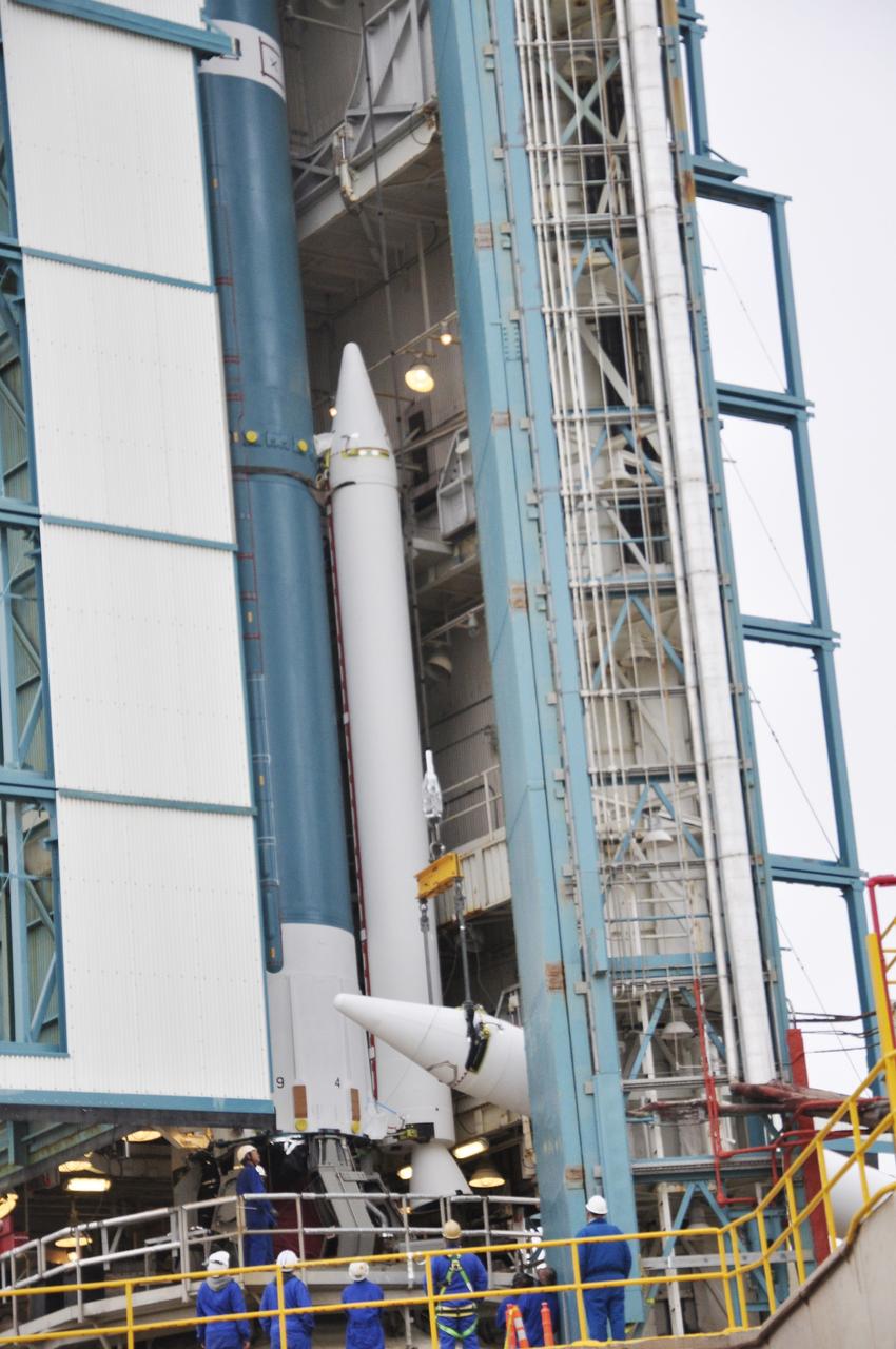 VANDENBERG AIR FORCE BASE, Calif. – A crane lifts the third solid rocket motor, or SRM, for NASA's Orbiting Carbon Observatory-2 mission, or OCO-2, into a vertical position at the mobile service tower at Space Launch Complex 2 on Vandenberg Air Force Base in California. Operations are underway to attach the Delta II rocket's three SRMs, known as graphite epoxy motors, to its first stage. OCO-2 is scheduled to launch into a polar Earth orbit aboard a United Launch Alliance Delta II 7320-10C rocket in July. Once in orbit, OCO-2 will collect precise global measurements of carbon dioxide in the Earth's atmosphere and provide scientists with a better idea of the chemical compound's impacts on climate change. Scientists will analyze this data to improve our understanding of the natural processes and human activities that regulate the abundance and distribution of this important atmospheric gas. To learn more about OCO-2, visit http://oco.jpl.nasa.gov. Photo credit: NASA/Randy Beaudoin
