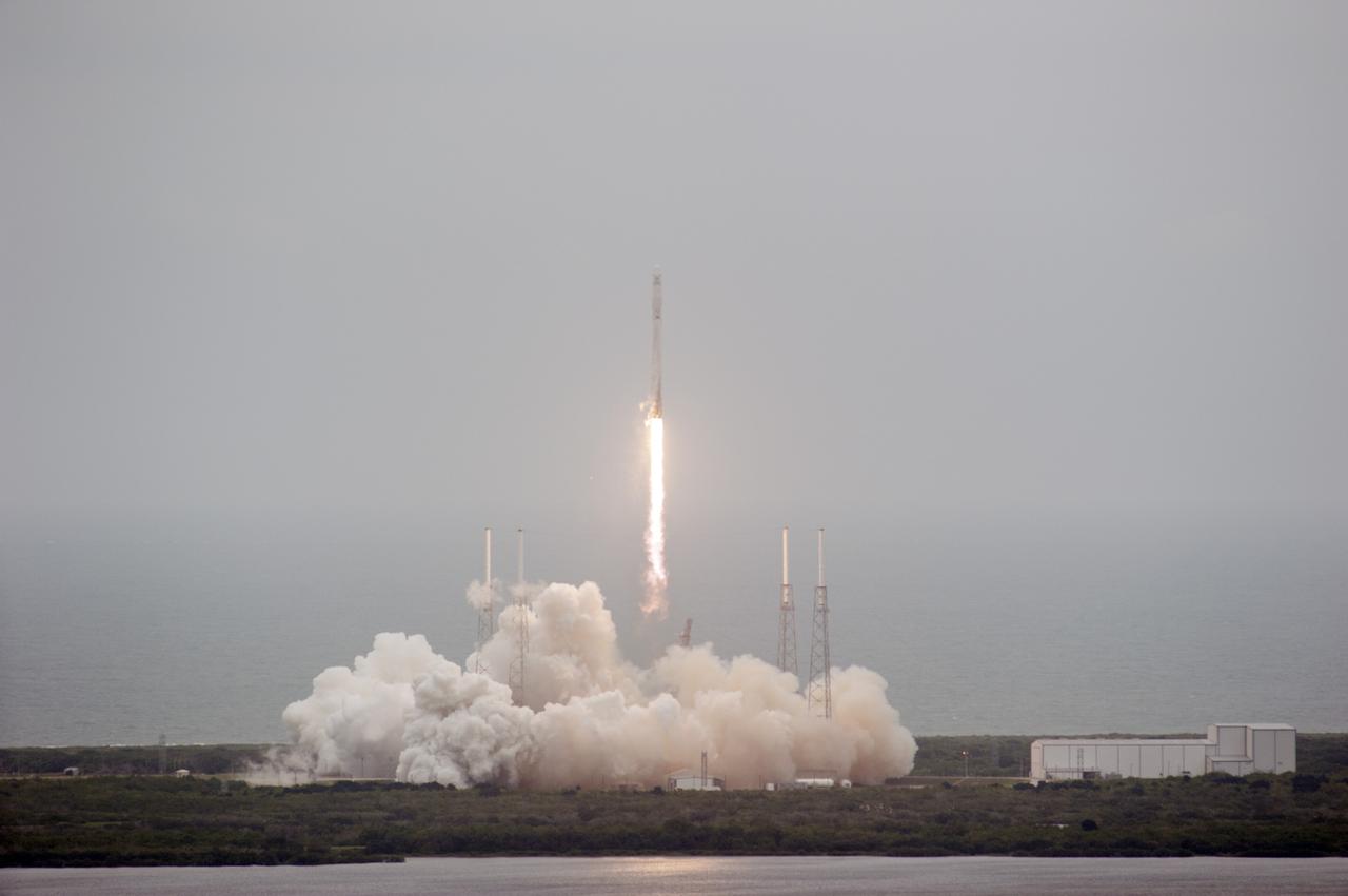 CAPE CANAVERAL, Fla. - The SpaceX Falcon 9 rocket rises above the lightning masts on Space Launch Complex 40 at Cape Canaveral Air Force Station, carrying the Dragon resupply spacecraft to the International Space Station. Liftoff was during an instantaneous window at 3:25 p.m. EDT.    Dragon is making its fourth trip to the space station. The SpaceX-3 mission, carrying almost 2.5 tons of supplies, technology and science experiments, is the third of 12 flights under NASA's Commercial Resupply Services contract to resupply the orbiting laboratory. For more information, visit http://www.nasa.gov/mission_pages/station/structure/launch/index.html.  Photo credit: NASA/Kim Shiflett