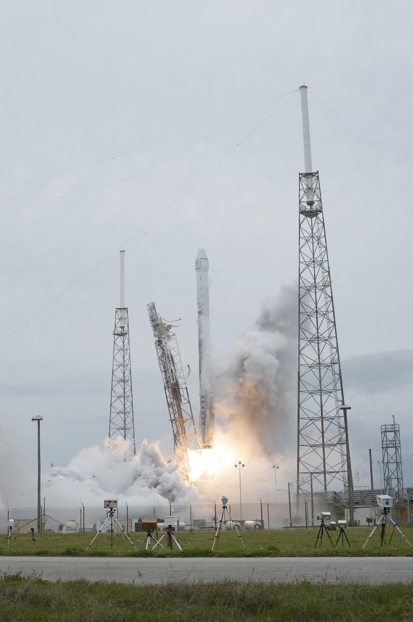 CAPE CANAVERAL, Fla. - Muddy water standing on the pad surface contributes to the formation of a dark exhaust cloud around the Falcon 9 rocket at Space Launch Complex 40 on Cape Canaveral Air Force Station as the SpaceX-3 mission lifts off, sendng the Dragon resupply spacecraft on its way to the International Space Station. Launch was during an instantaneous window at 3:25 p.m. EDT.      Dragon is making its fourth trip to the space station. The SpaceX-3 mission, carrying almost 2.5 tons of supplies, technology and science experiments, is the third of 12 flights through a $1.6 billion NASA Commercial Resupply Services contract. Dragon's cargo will support more than 150 experiments that will be conducted during the station's Expeditions 39 and 40.  For more information, visit http://www.nasa.gov/mission_pages/station/structure/launch/index.html.  Photo credit: NASA/Tony Gray and Tim Terry