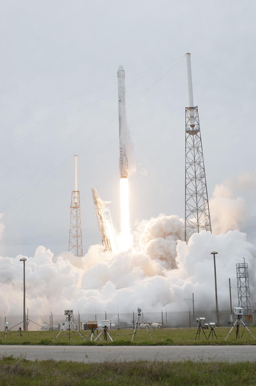 CAPE CANAVERAL, Fla. - The SpaceX Falcon 9 rocket rises above the lightning masts on Space Launch Complex 40 at Cape Canaveral Air Force Station, sending the Dragon resupply spacecraft on its way to the International Space Station. Liftoff was during an instantaneous window at 3:25 p.m. EDT.      Dragon is making its fourth trip to the space station. The SpaceX-3 mission, carrying almost 2.5 tons of supplies, technology and science experiments, is the third of 12 flights through a $1.6 billion NASA Commercial Resupply Services contract. Dragon's cargo will support more than 150 experiments that will be conducted during the station's Expeditions 39 and 40.  For more information, visit http://www.nasa.gov/mission_pages/station/structure/launch/index.html.  Photo credit: NASA/Tony Gray and Tim Terry