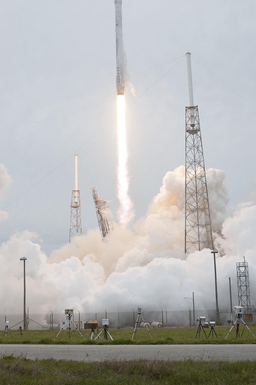 CAPE CANAVERAL, Fla. - Remote-controlled and sound-activated cameras placed around the perimeter of the pad by media organizations capture images of the SpaceX Falcon 9 rocket as it rises off Space Launch Complex 40 at Cape Canaveral Air Force Station, sending the Dragon resupply spacecraft on its way to the International Space Station. Liftoff was during an instantaneous window at 3:25 p.m. EDT.      Dragon is making its fourth trip to the space station. The SpaceX-3 mission, carrying almost 2.5 tons of supplies, technology and science experiments, is the third of 12 flights through a $1.6 billion NASA Commercial Resupply Services contract. Dragon's cargo will support more than 150 experiments that will be conducted during the station's Expeditions 39 and 40.  For more information, visit http://www.nasa.gov/mission_pages/station/structure/launch/index.html.  Photo credit: NASA/Tony Gray and Tim Terry