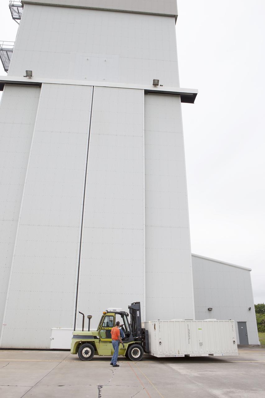 CAPE CANAVERAL, Fla. - The second set of two Ogive panels for the Orion Launch Abort System arrives by truck at the Launch Abort System Facility, or LASF, at NASA’s Kennedy Space Center in Florida. The Ogive panels will be uncrated inside the LASF. During processing, the panels will be secured around the Orion crew module and attached to the Launch Abort System. Orion is the exploration spacecraft designed to carry astronauts to destinations not yet explored by humans, including an asteroid and Mars. It will have emergency abort capability, sustain the crew during space travel and provide safe re-entry from deep space return velocities. The first unpiloted test flight of Orion is scheduled to launch in 2014 atop a Delta IV rocket and in 2017 on NASA’s Space Launch System rocket. For more information, visit www.nasa.gov/orion. Photo credit: Kim Shiflett