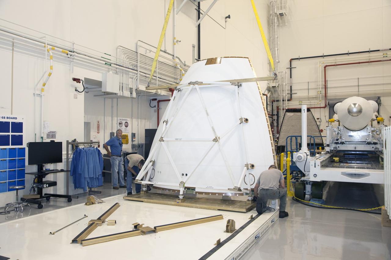 CAPE CANAVERAL, Fla. - The first set of two Ogive panels for the Orion Launch Abort System was uncrated inside the Launch Abort System Facility, or LASF, at NASA’s Kennedy Space Center in Florida. One of the panels has been lifted by crane and technicians are preparing it for the move to a storage stand at the other end of the facility. During processing, the panels will be secured around the Orion crew module and attached to the Launch Abort System. Orion is the exploration spacecraft designed to carry astronauts to destinations not yet explored by humans, including an asteroid and Mars. It will have emergency abort capability, sustain the crew during space travel and provide safe re-entry from deep space return velocities. The first unpiloted test flight of Orion is scheduled to launch in 2014 atop a Delta IV rocket and in 2017 on NASA’s Space Launch System rocket. For more information, visit www.nasa.gov/orion. Photo credit: Dan Casper