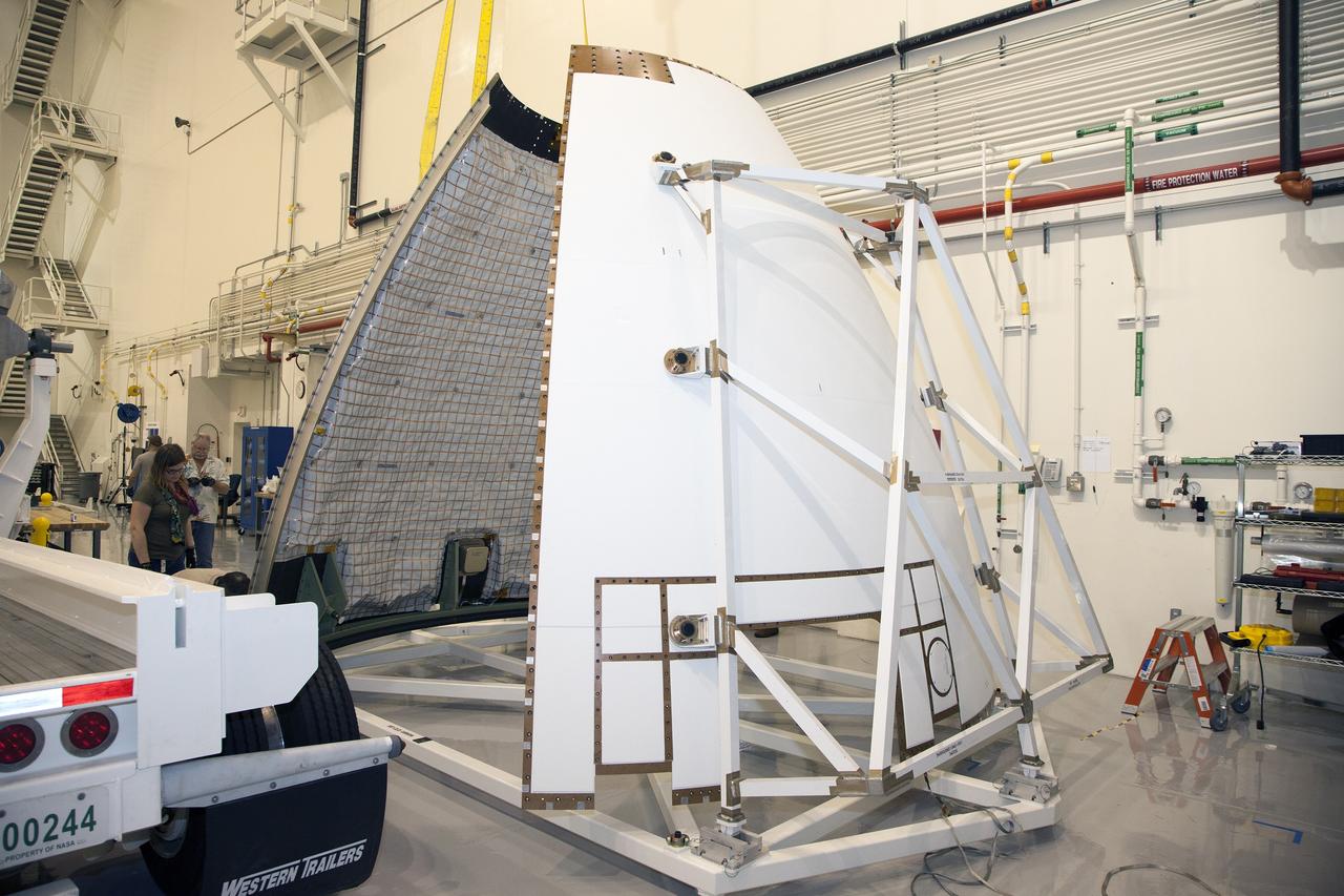 CAPE CANAVERAL, Fla. - The first set of two Ogive panels for the Orion Launch Abort System was uncrated inside the Launch Abort System Facility, or LASF, at NASA’s Kennedy Space Center in Florida. Both panels were moved by crane and lowered onto a storage stand at the far end of the facility. During processing, the panels will be secured around the Orion crew module and attached to the Launch Abort System. Orion is the exploration spacecraft designed to carry astronauts to destinations not yet explored by humans, including an asteroid and Mars. It will have emergency abort capability, sustain the crew during space travel and provide safe re-entry from deep space return velocities. The first unpiloted test flight of Orion is scheduled to launch in 2014 atop a Delta IV rocket and in 2017 on NASA’s Space Launch System rocket. For more information, visit www.nasa.gov/orion. Photo credit: Dan Casper