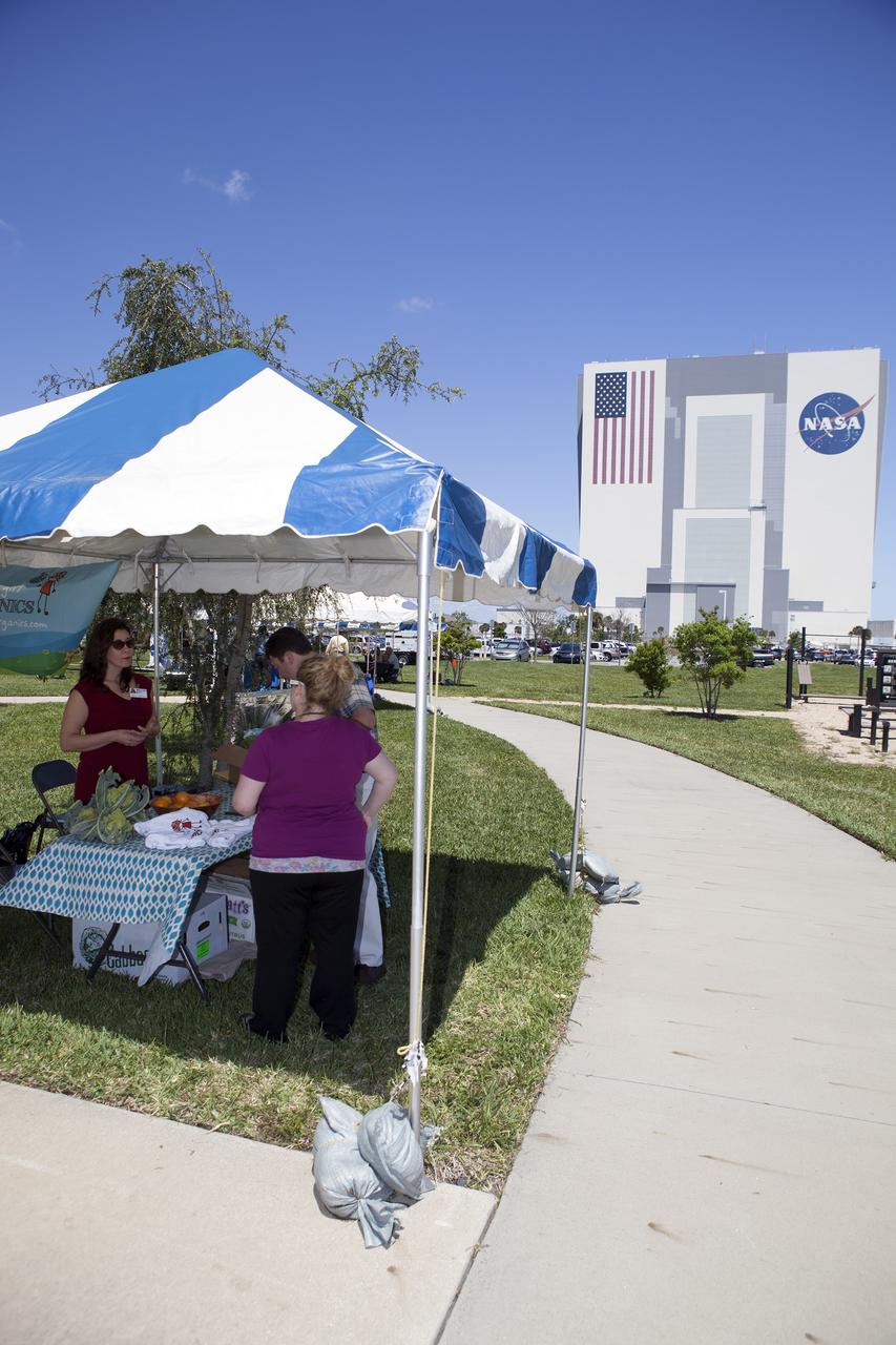 CAPE CANAVERAL, Fla. -- NASA's Kennedy Space Center in Florida hosts a Sustainability Fair in observance of Earth Day. The fair was held adjacent to the Pathfinder Fitness Trail across the street from the 525-foot-tall Vehicle Assembly Building in Launch Complex 39.    Kennedy Earth Day events included booths by a dozen sustainable companies and environmental organizations, displays on organic gardening, recycling, sustainable materials, alternative fuels and wildlife, and test-drives of several alternative-fuel vehicles.  In keeping with the national theme, "Green Cities," the fair provided employees with the opportunity to learn how to do their parts in securing a healthy and sustainable future for their cities and the planet.  The space center's sustainability objective is to "promote, maintain and pioneer green practices in all aspects of our mission, striving to be an agency leader in everything we do." For more information on Kennedy's sustainability policy, visit http://www.nasa.gov/centers/kennedy/about/sustainability. Photo credit: NASA/Dimitri Gerondidakis