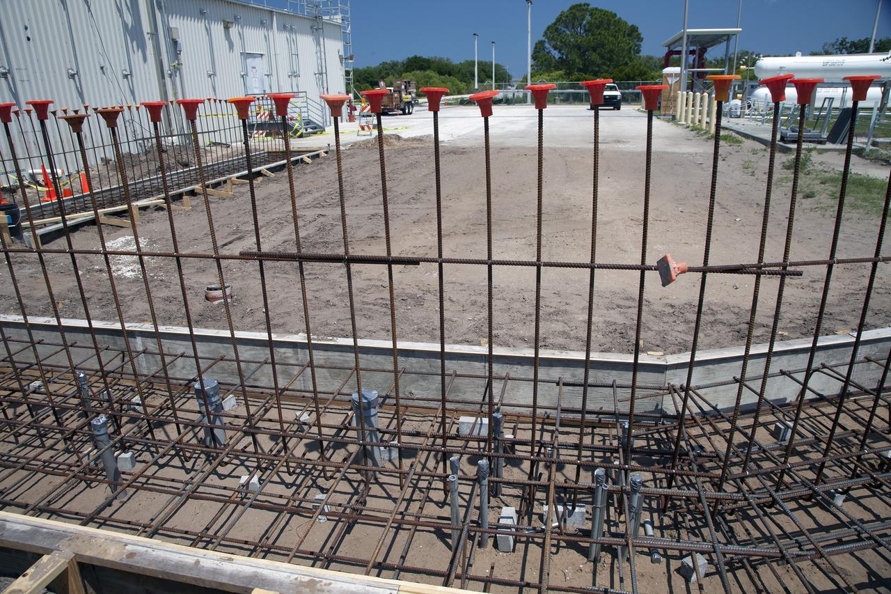 CAPE CANAVERAL, Fla. – Modifications continue on the Multi-Payload Processing Facility, or MPPF, at NASA's Kennedy Space Center in Florida. Construction workers have laid rebar and conduits have been placed for the hypergol scrubber containment wall.    Kennedy's Center Operations Directorate is overseeing upgrades to the MPPF for the Ground Systems Development and Operations Program. The extensive upgrades and modernizations will support processing of Orion spacecraft for NASA's exploration missions. The 19,647-square-foot building, originally constructed in 1995, primarily will be used for Orion hypergolic fueling, ammonia servicing and high-pressure gas servicing and checkout before being transported to the Vehicle Assembly Building for integration with the Space Launch System. Photo credit: NASA/Daniel Casper