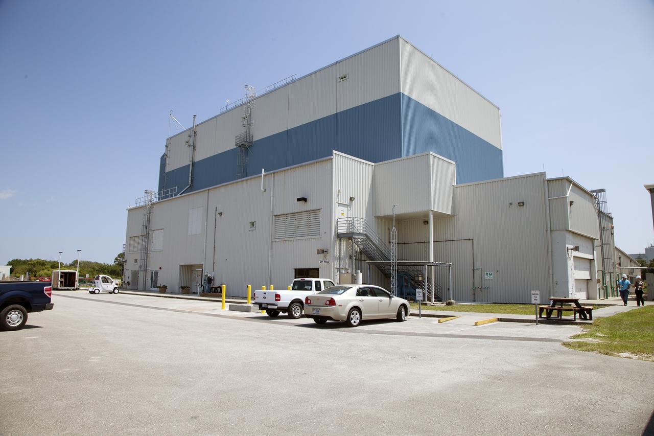 CAPE CANAVERAL, Fla. – Modifications continue on the Multi-Payload Processing Facility, or MPPF, at NASA's Kennedy Space Center in Florida. A view looking northwest, shows the exterior of the MPPF.    Kennedy's Center Operations Directorate is overseeing upgrades to the MPPF for the Ground Systems Development and Operations Program. The extensive upgrades and modernizations will support processing of Orion spacecraft for NASA's exploration missions. The 19,647-square-foot building, originally constructed in 1995, primarily will be used for Orion hypergolic fueling, ammonia servicing and high-pressure gas servicing and checkout before being transported to the Vehicle Assembly Building for integration with the Space Launch System. Photo credit: NASA/Daniel Casper
