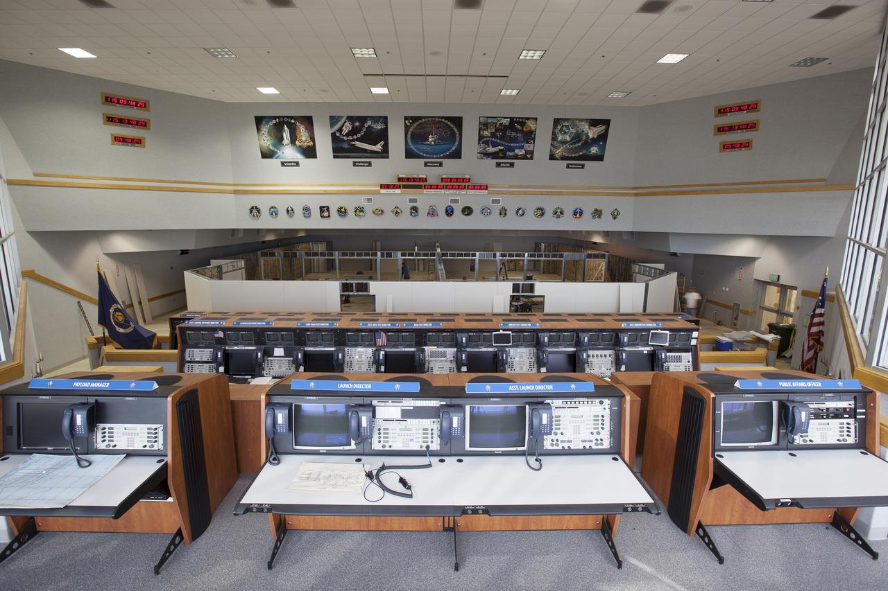 CAPE CANAVERAL, Fla. – Construction workers have installed the framing and some of the inner walls inside Firing Room 4 in the Launch Control Center at NASA's Kennedy Space Center in Florida. Three rows of upper level management consoles remain. The Ground Systems Development and Operations Program is overseeing efforts to create a new firing room based on a multi-user concept.    The design of Firing Room 4 will incorporate five control room areas that are flexible to meet current and future NASA and commercial user requirements. The equipment and most of the consoles from Firing Room 4 were moved to Firing Room 2 for possible future reuse. Photo credit: NASA/Dimitri Gerondidakis