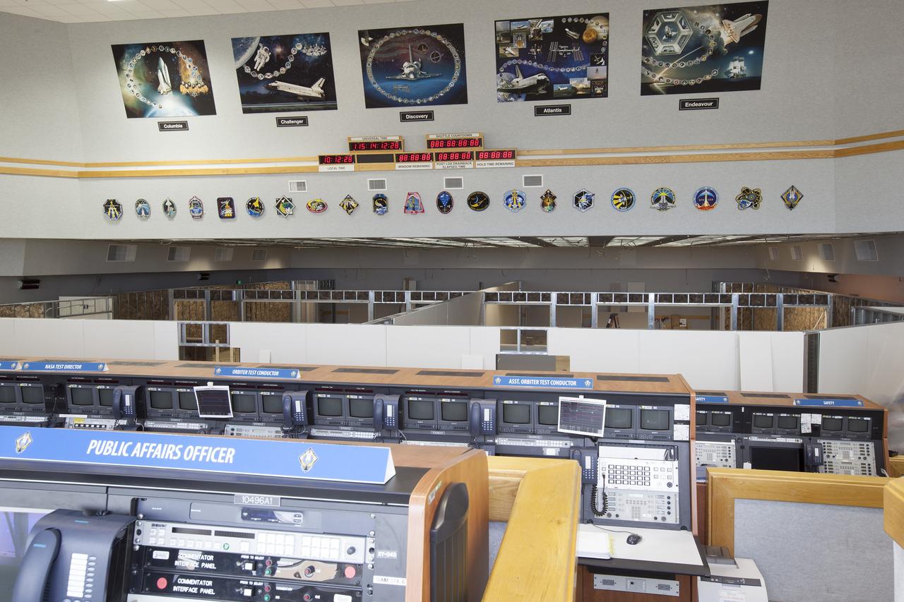 CAPE CANAVERAL, Fla. – Modifications to Firing Room 4 in the Launch Control Center at NASA's Kennedy Space Center in Florida continue to take shape. Construction workers have installed the framing and some of the inner walls. Three rows of upper level management consoles remain. The Ground Systems Development and Operations Program is overseeing efforts to create a new firing room based on a multi-user concept. The design of Firing Room 4 will incorporate five control room areas that are flexible to meet current and future NASA and commercial user requirements. The equipment and most of the consoles from Firing Room 4 were moved to Firing Room 2 for possible future reuse. Photo credit: NASA/Dimitri Gerondidakis