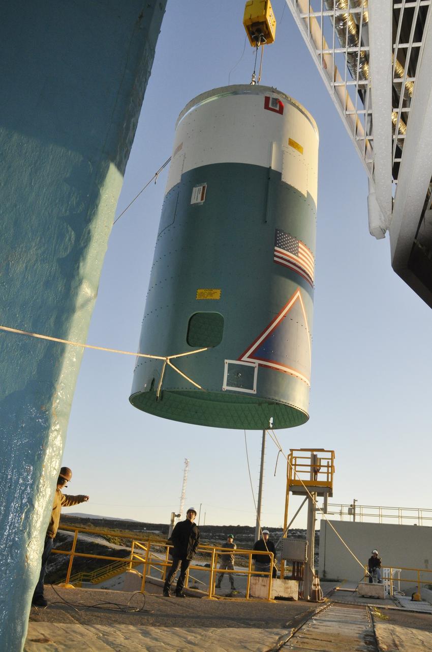 VANDENBERG AIR FORCE BASE, Calif. – A crane lifts the interstage adapter, or ISA, for NASA's Orbiting Carbon Observatory-2 mission, or OCO-2, up the side of the mobile service tower at Space Launch Complex 2 on Vandenberg Air Force Base in California.    OCO-2 is scheduled to launch into a polar Earth orbit aboard a United Launch Alliance Delta II 7320-10C rocket in July. The ISA is the interface between the Delta II first and second stages. The second stage engine fits within the ISA. Once in orbit, OCO-2 will collect precise global measurements of carbon dioxide in the Earth's atmosphere and provide scientists with a better idea of the chemical compound's impacts on climate change. Scientists will analyze this data to improve our understanding of the natural processes and human activities that regulate the abundance and distribution of this important atmospheric gas. To learn more about OCO-2, visit http://oco.jpl.nasa.gov.  Photo credit: NASA/Randy Beaudoin