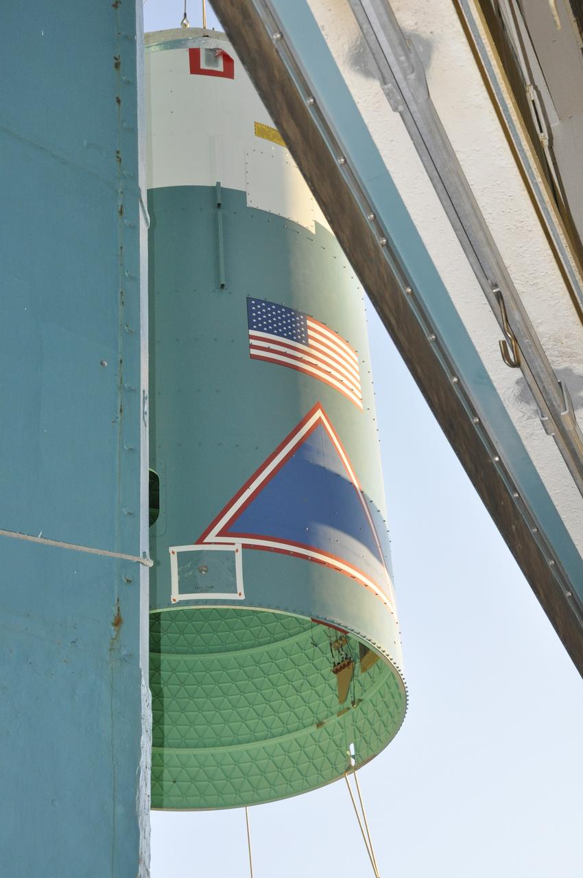VANDENBERG AIR FORCE BASE, Calif. – The interstage adapter, or ISA, for NASA's Orbiting Carbon Observatory-2 mission, or OCO-2, glides up the side of the mobile service tower at Space Launch Complex 2 on Vandenberg Air Force Base in California, tethered to a crane.    OCO-2 is scheduled to launch into a polar Earth orbit aboard a United Launch Alliance Delta II 7320-10C rocket in July. The ISA is the interface between the Delta II first and second stages. The second stage engine fits within the ISA. Once in orbit, OCO-2 will collect precise global measurements of carbon dioxide in the Earth's atmosphere and provide scientists with a better idea of the chemical compound's impacts on climate change. Scientists will analyze this data to improve our understanding of the natural processes and human activities that regulate the abundance and distribution of this important atmospheric gas. To learn more about OCO-2, visit http://oco.jpl.nasa.gov.  Photo credit: NASA/Randy Beaudoin