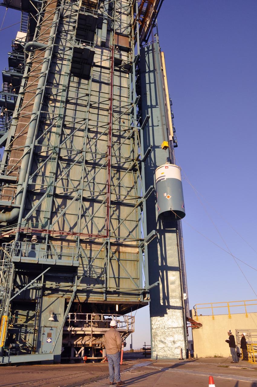 VANDENBERG AIR FORCE BASE, Calif. – Workers stand watch as a crane pulls the interstage adapter, or ISA, for NASA's Orbiting Carbon Observatory-2 mission, or OCO-2, up the side of the mobile service tower at Space Launch Complex 2 on Vandenberg Air Force Base in California.    OCO-2 is scheduled to launch into a polar Earth orbit aboard a United Launch Alliance Delta II 7320-10C rocket in July. The ISA is the interface between the Delta II first and second stages. The second stage engine fits within the ISA. Once in orbit, OCO-2 will collect precise global measurements of carbon dioxide in the Earth's atmosphere and provide scientists with a better idea of the chemical compound's impacts on climate change. Scientists will analyze this data to improve our understanding of the natural processes and human activities that regulate the abundance and distribution of this important atmospheric gas. To learn more about OCO-2, visit http://oco.jpl.nasa.gov.  Photo credit: NASA/Randy Beaudoin