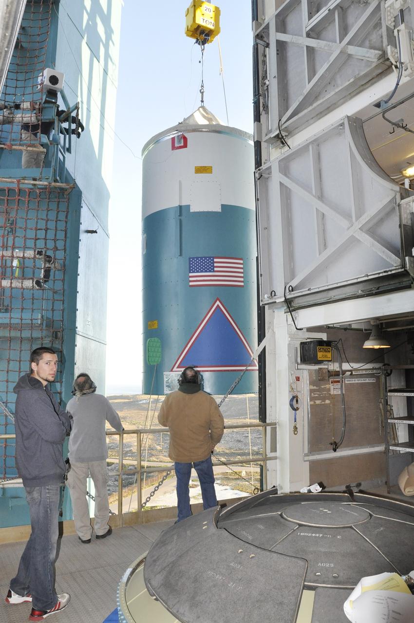 VANDENBERG AIR FORCE BASE, Calif. – The interstage adapter, or ISA, for NASA's Orbiting Carbon Observatory-2 mission, or OCO-2, arrives in the environmental enclosure, or clean room, near the top of the mobile service tower at Space Launch Complex 2 on Vandenberg Air Force Base in California.    OCO-2 is scheduled to launch into a polar Earth orbit aboard a United Launch Alliance Delta II 7320-10C rocket in July. The ISA is the interface between the Delta II first and second stages. The second stage engine fits within the ISA. Once in orbit, OCO-2 will collect precise global measurements of carbon dioxide in the Earth's atmosphere and provide scientists with a better idea of the chemical compound's impacts on climate change. Scientists will analyze this data to improve our understanding of the natural processes and human activities that regulate the abundance and distribution of this important atmospheric gas. To learn more about OCO-2, visit http://oco.jpl.nasa.gov.  Photo credit: NASA/Randy Beaudoin