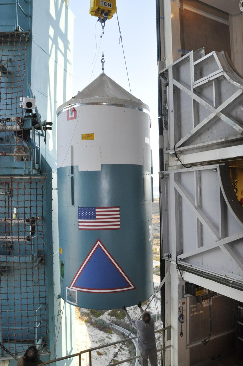VANDENBERG AIR FORCE BASE, Calif. – A worker steadies the interstage adapter, or ISA, for NASA's Orbiting Carbon Observatory-2 mission, or OCO-2, upon its arrival in the environmental enclosure, or clean room, near the top of the mobile service tower at Space Launch Complex 2 on Vandenberg Air Force Base in California.    OCO-2 is scheduled to launch into a polar Earth orbit aboard a United Launch Alliance Delta II 7320-10C rocket in July. The ISA is the interface between the Delta II first and second stages. The second stage engine fits within the ISA. Once in orbit, OCO-2 will collect precise global measurements of carbon dioxide in the Earth's atmosphere and provide scientists with a better idea of the chemical compound's impacts on climate change. Scientists will analyze this data to improve our understanding of the natural processes and human activities that regulate the abundance and distribution of this important atmospheric gas. To learn more about OCO-2, visit http://oco.jpl.nasa.gov.  Photo credit: NASA/Randy Beaudoin
