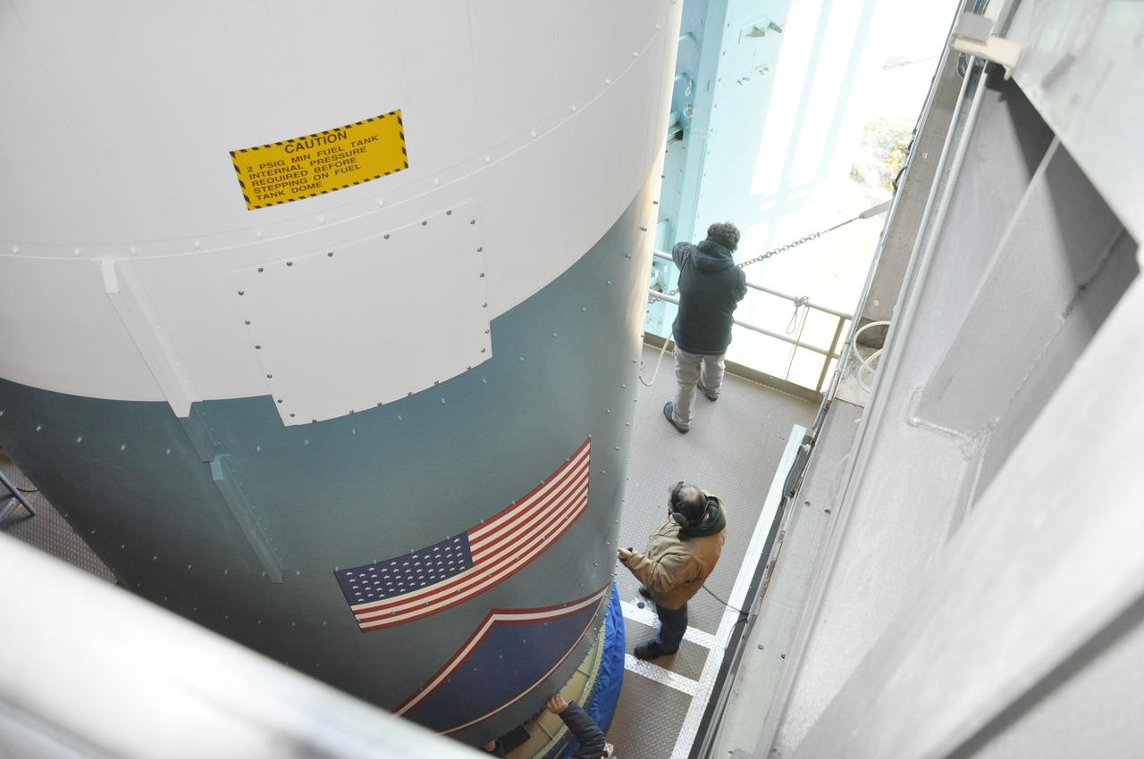 VANDENBERG AIR FORCE BASE, Calif. – Preparations are underway to connect the Delta II first stage for NASA's Orbiting Carbon Observatory-2 mission, or OCO-2, to the interstage adapter, or ISA, newly delivered to the environmental enclosure, or clean room, near the top of the mobile service tower at Space Launch Complex 2 on Vandenberg Air Force Base in California.    OCO-2 is scheduled to launch into a polar Earth orbit aboard a United Launch Alliance Delta II 7320-10C rocket in July. The ISA is the interface between the Delta II first and second stages. The second stage engine fits within the ISA. Once in orbit, OCO-2 will collect precise global measurements of carbon dioxide in the Earth's atmosphere and provide scientists with a better idea of the chemical compound's impacts on climate change. Scientists will analyze this data to improve our understanding of the natural processes and human activities that regulate the abundance and distribution of this important atmospheric gas. To learn more about OCO-2, visit http://oco.jpl.nasa.gov.  Photo credit: NASA/Randy Beaudoin