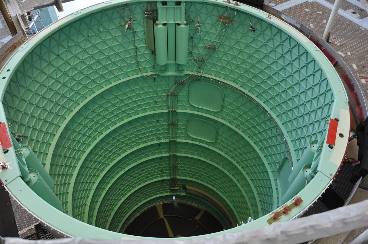 VANDENBERG AIR FORCE BASE, Calif. – The interstage adapter, or ISA, for NASA's Orbiting Carbon Observatory-2 mission, or OCO-2, is connected to the Delta II first stage in the mobile service tower at Space Launch Complex 2 on Vandenberg Air Force Base in California and ready for delivery of the rocket's second stage.    OCO-2 is scheduled to launch into a polar Earth orbit aboard a United Launch Alliance Delta II 7320-10C rocket in July. The ISA is the interface between the Delta II first and second stages. The second stage engine fits within the ISA. Once in orbit, OCO-2 will collect precise global measurements of carbon dioxide in the Earth's atmosphere and provide scientists with a better idea of the chemical compound's impacts on climate change. Scientists will analyze this data to improve our understanding of the natural processes and human activities that regulate the abundance and distribution of this important atmospheric gas. To learn more about OCO-2, visit http://oco.jpl.nasa.gov.  Photo credit: NASA/Randy Beaudoin