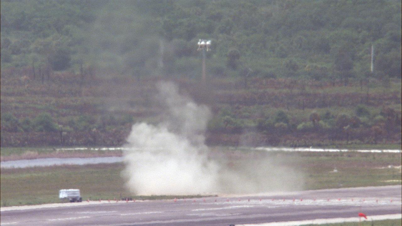 CAPE CANAVERAL, Fla. – NASA's Project Morpheus prototype lander soars high after lifting off on a free-flight test from a new launch pad at the north end of the Shuttle Landing Facility at NASA's Kennedy Space Center in Florida. The 98-second test began at 1:57 p.m. EDT with the Morpheus lander launching from the ground over a flame trench and ascending more than 800 feet at a peak speed of 36 mph. The vehicle, with its recently installed autonomous landing and hazard avoidance technology, or ALHAT, sensors surveyed the hazard field to determine safe landing sites. Morpheus then flew forward and downward covering approximately 1300 feet while performing a 78-foot divert to simulate a hazard avoidance maneuver. The lander descended and landed on a dedicated pad inside the ALHAT hazard field. Project Morpheus tests NASA’s ALHAT and an engine that runs on liquid oxygen and methane, which are green propellants. These new capabilities could be used in future efforts to deliver cargo to planetary surfaces.    The landing facility provides the lander with the kind of field necessary for realistic testing, complete with rocks, craters and hazards to avoid. Morpheus’ ALHAT payload allows it to navigate to clear landing sites amidst rocks, craters and other hazards during its descent. Project Morpheus is being managed under the Advanced Exploration Systems, or AES, Division in NASA’s Human Exploration and Operations Mission Directorate. The efforts in AES pioneer new approaches for rapidly developing prototype systems, demonstrating key capabilities and validating operational concepts for future human missions beyond Earth orbit. For more information on Project Morpheus, visit http://morpheuslander.jsc.nasa.gov/.  Photo credit: NASA/Frankie Martin