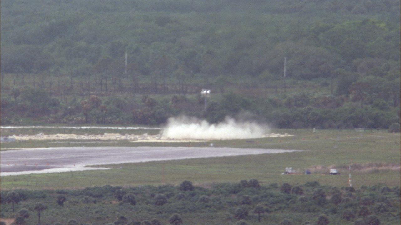 CAPE CANAVERAL, Fla. – NASA's Project Morpheus prototype lander begins to descend toward the autonomous landing and hazard avoidance technology, or ALHAT, field after lifting off on a free-flight test from a new launch pad at the north end of the Shuttle Landing Facility at NASA's Kennedy Space Center in Florida. The 98-second test began at 1:57 p.m. EDT with the Morpheus lander launching from the ground over a flame trench and ascending more than 800 feet at a peak speed of 36 mph. The vehicle, with its recently installed ALHAT sensors, surveyed the hazard field to determine safe landing sites. Morpheus then flew forward and downward covering approximately 1300 feet while performing a 78-foot divert to simulate a hazard avoidance maneuver. The lander descended and landed on a dedicated pad inside the ALHAT hazard field. Project Morpheus tests NASA’s ALHAT and an engine that runs on liquid oxygen and methane, which are green propellants. These new capabilities could be used in future efforts to deliver cargo to planetary surfaces.    The landing facility provides the lander with the kind of field necessary for realistic testing, complete with rocks, craters and hazards to avoid. Morpheus’ ALHAT payload allows it to navigate to clear landing sites amidst rocks, craters and other hazards during its descent. Project Morpheus is being managed under the Advanced Exploration Systems, or AES, Division in NASA’s Human Exploration and Operations Mission Directorate. The efforts in AES pioneer new approaches for rapidly developing prototype systems, demonstrating key capabilities and validating operational concepts for future human missions beyond Earth orbit. For more information on Project Morpheus, visit http://morpheuslander.jsc.nasa.gov/.  Photo credit: NASA/Frankie Martin