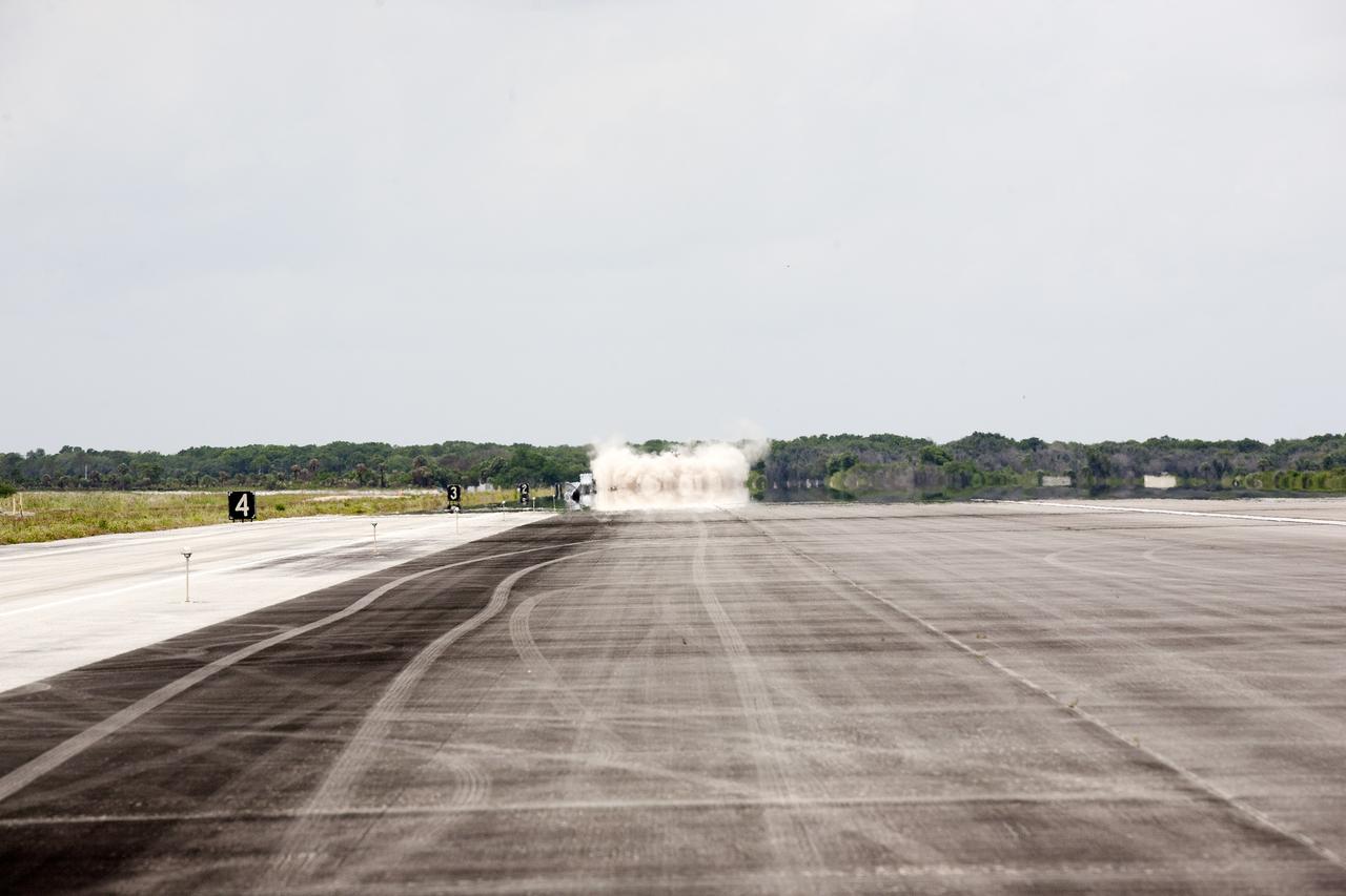 CAPE CANAVERAL, Fla. – NASA's Project Morpheus prototype lander touches down on the autonomous landing and hazard avoidance technology, or ALHAT, field after lifting off on a free-flight test from a new launch pad at the north end of the Shuttle Landing Facility at NASA's Kennedy Space Center in Florida. The 98-second test began at 1:57 p.m. EDT with the Morpheus lander launching from the ground over a flame trench and ascending more than 800 feet at a peak speed of 36 mph. The vehicle, with its recently installed ALHAT sensors, surveyed the hazard field to determine safe landing sites. Morpheus then flew forward and downward covering approximately 1300 feet while performing a 78-foot divert to simulate a hazard avoidance maneuver. The lander descended and landed on a dedicated pad inside the ALHAT hazard field. Project Morpheus tests NASA’s ALHAT and an engine that runs on liquid oxygen and methane, which are green propellants. These new capabilities could be used in future efforts to deliver cargo to planetary surfaces.    The landing facility provides the lander with the kind of field necessary for realistic testing, complete with rocks, craters and hazards to avoid. Morpheus’ ALHAT payload allows it to navigate to clear landing sites amidst rocks, craters and other hazards during its descent. Project Morpheus is being managed under the Advanced Exploration Systems, or AES, Division in NASA’s Human Exploration and Operations Mission Directorate. The efforts in AES pioneer new approaches for rapidly developing prototype systems, demonstrating key capabilities and validating operational concepts for future human missions beyond Earth orbit. For more information on Project Morpheus, visit http://morpheuslander.jsc.nasa.gov/.  Photo credit: NASA/Kim Shiflett