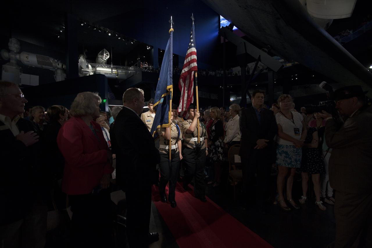 CAPE CANAVERAL, Fla. – Inside the Space Shuttle Atlantis attraction at NASA’s Kennedy Space Center Visitor Complex in Florida, the Titusville Naval Junior ROTC from Titusville High School in Florida, presents the colors to open the U.S. Astronaut Hall of Fame Induction ceremony. Space shuttle astronauts and space explorers Shannon Lucid and Jerry Ross were inducted into the Hall of Fame Class of 2014.    The 2014 inductees are selected by a committee of Hall of Fame astronauts, former NASA officials, flight directors, historians and journalists. The process is administered by the Astronaut Scholarship Foundation. To be eligible, an astronaut must have made his or her first flight at least 17 years before the induction. Candidates must be a U.S. citizen and a NASA-trained commander, pilot or mission specialist who has orbited the earth at least once. Including Lucid and Ross, 87 astronauts have been inducted into the AHOF.  Photo credit: NASA/Kim Shiflett
